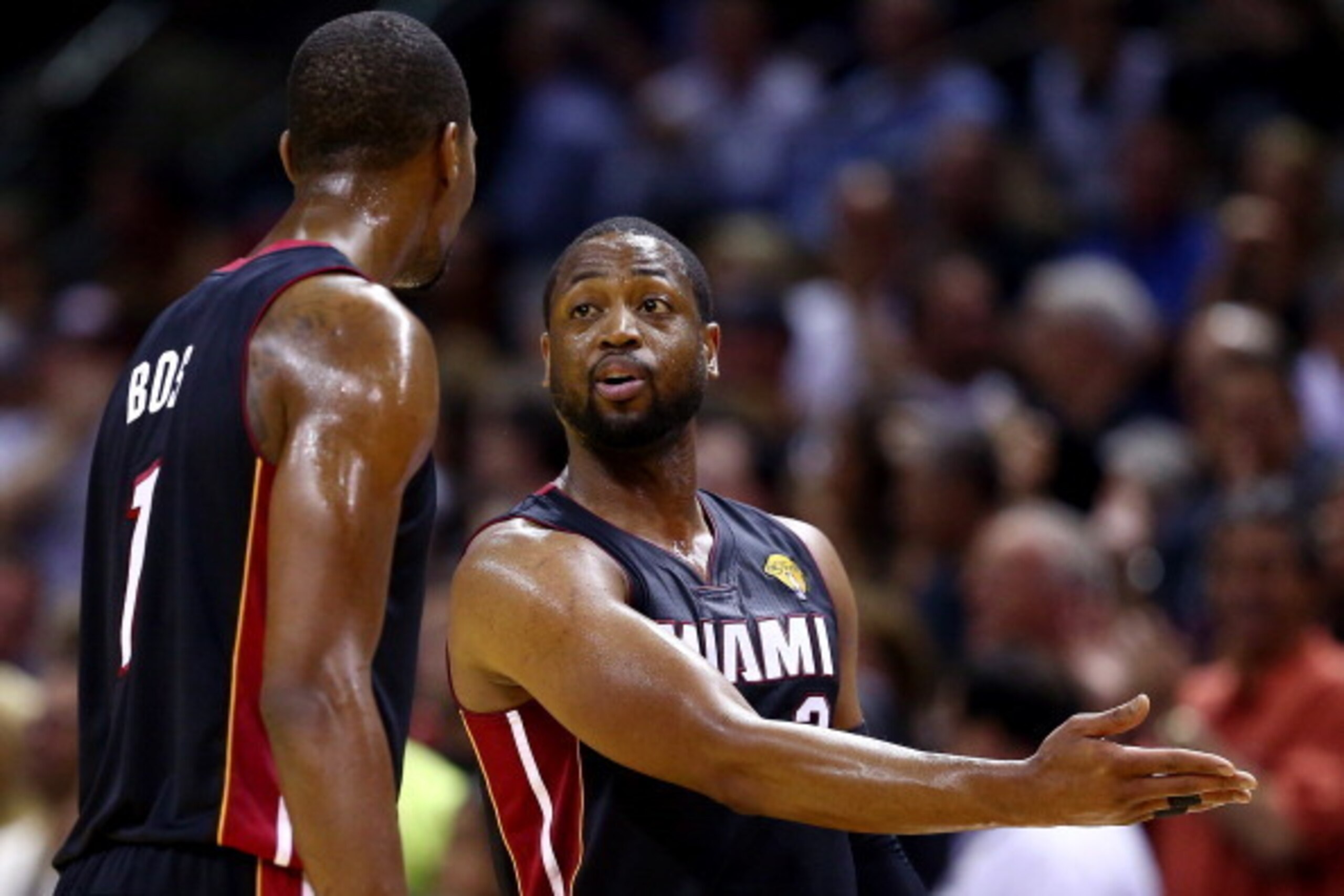 SAN ANTONIO, TX - JUNE 08:  Dwyane Wade #3 speaks to Chris Bosh #1 of the Miami Heat against the San Antonio Spurs during Game Two of the 2014 NBA Finals at the AT&T Center on June 8, 2014 in San Antonio, Texas. NOTE TO USER: User expressly acknowledges a