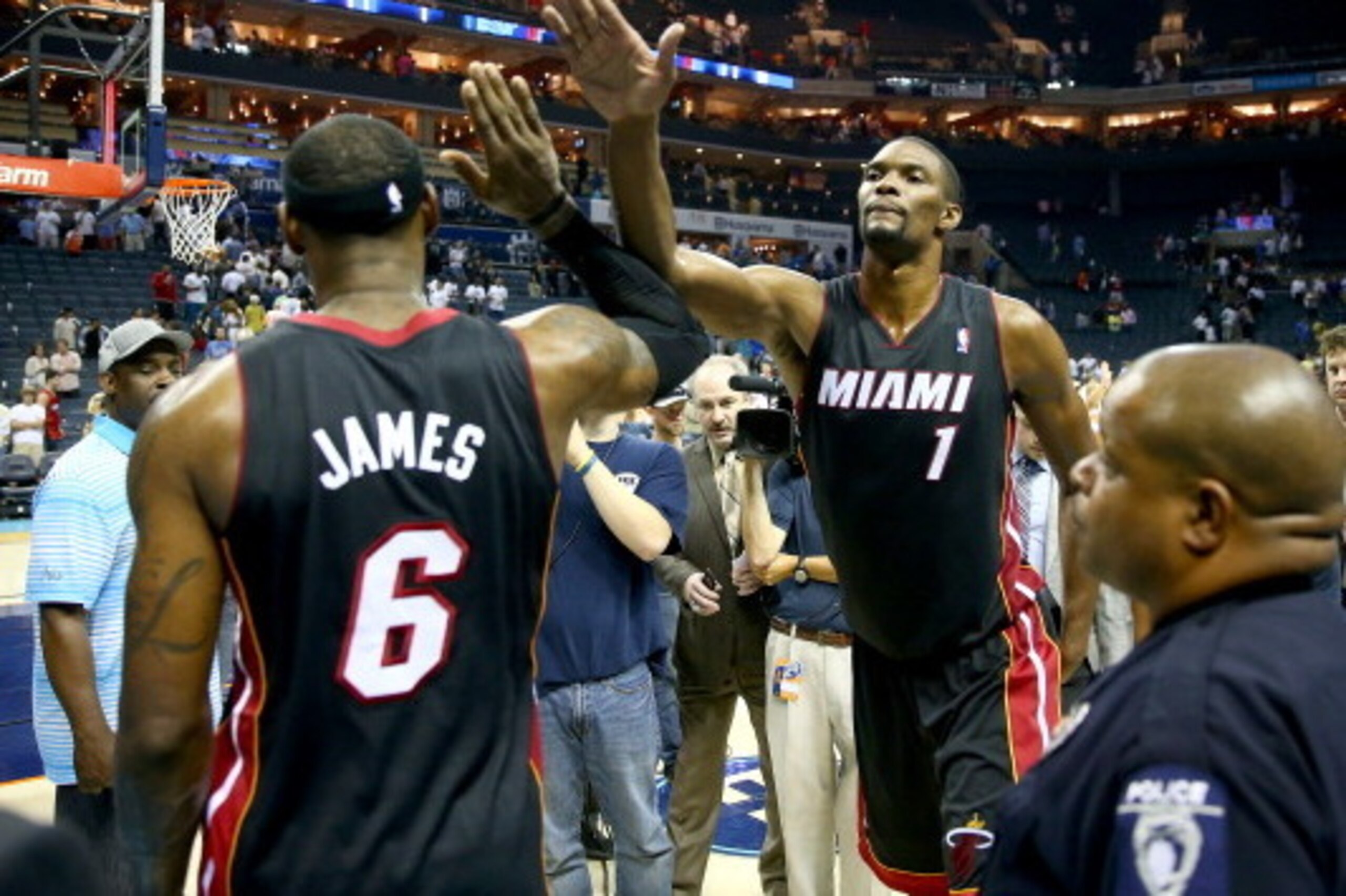 CHARLOTTE, NC - APRIL 28:  LeBron James #6 of the Miami Heat celebrates with teammate Chris Bosh after defeating the Charlotte Bobcats 109-98 in Game Four of the Eastern Conference Quarterfinals during the 2014 NBA Playoffs at Time Warner Cable Arena on A