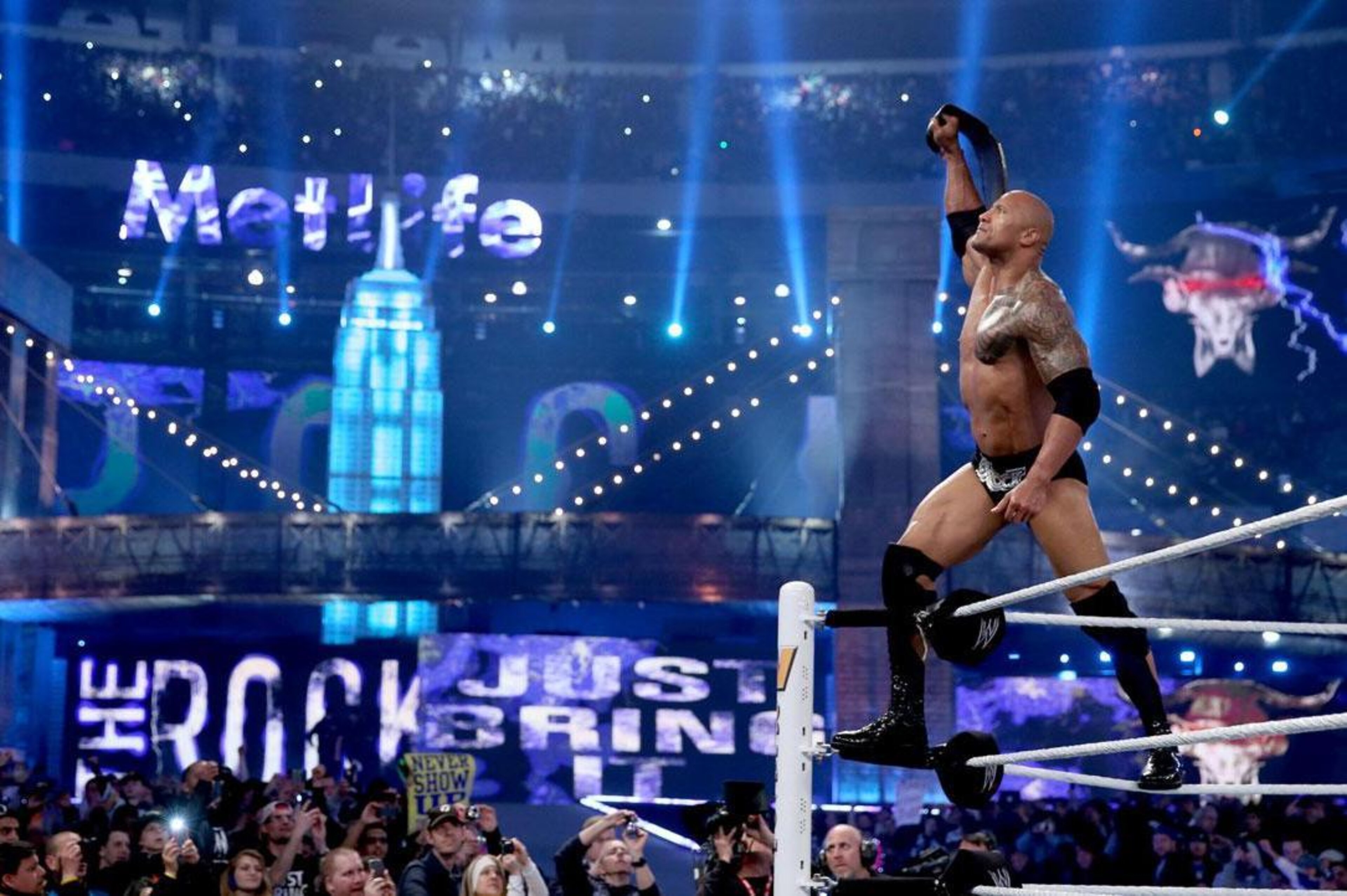 The Rock holds up the WWE title at WrestleMania 29. The Rock holds up the WWE title at WrestleMania 29.