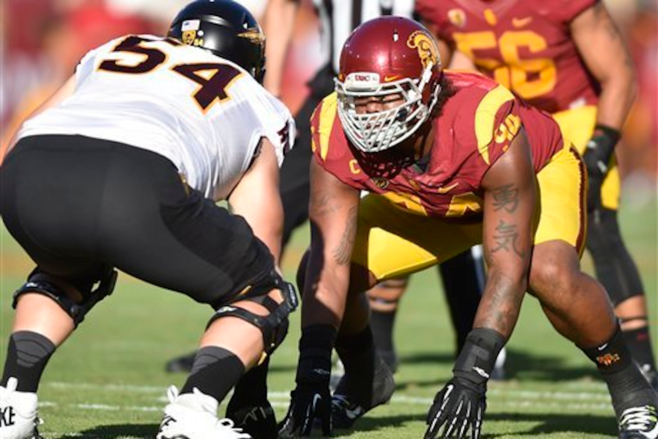 Defensive lineman Leonard Williams plays a central role in slowing Arizona's zone-read offense.