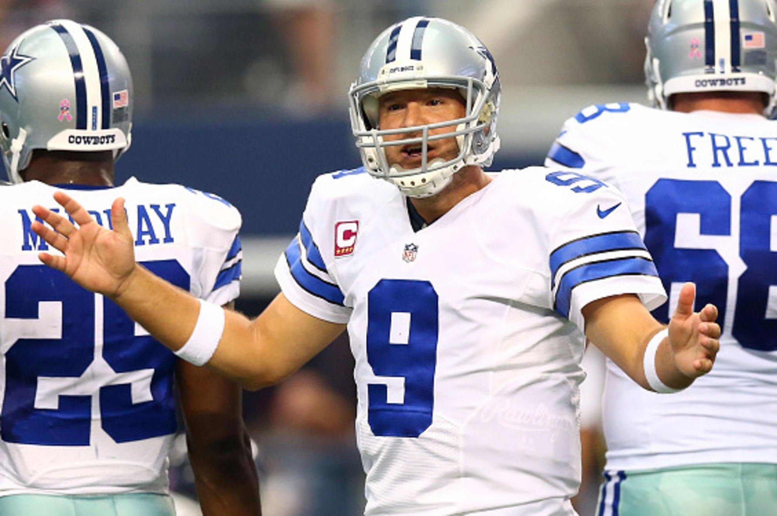 ARLINGTON, TX - OCTOBER 05:  Tony Romo #9 of the Dallas Cowboys directs his team against the Houston Texans in the first half at AT&T Stadium on October 5, 2014 in Arlington, Texas.  (Photo by Ronald Martinez/Getty Images)