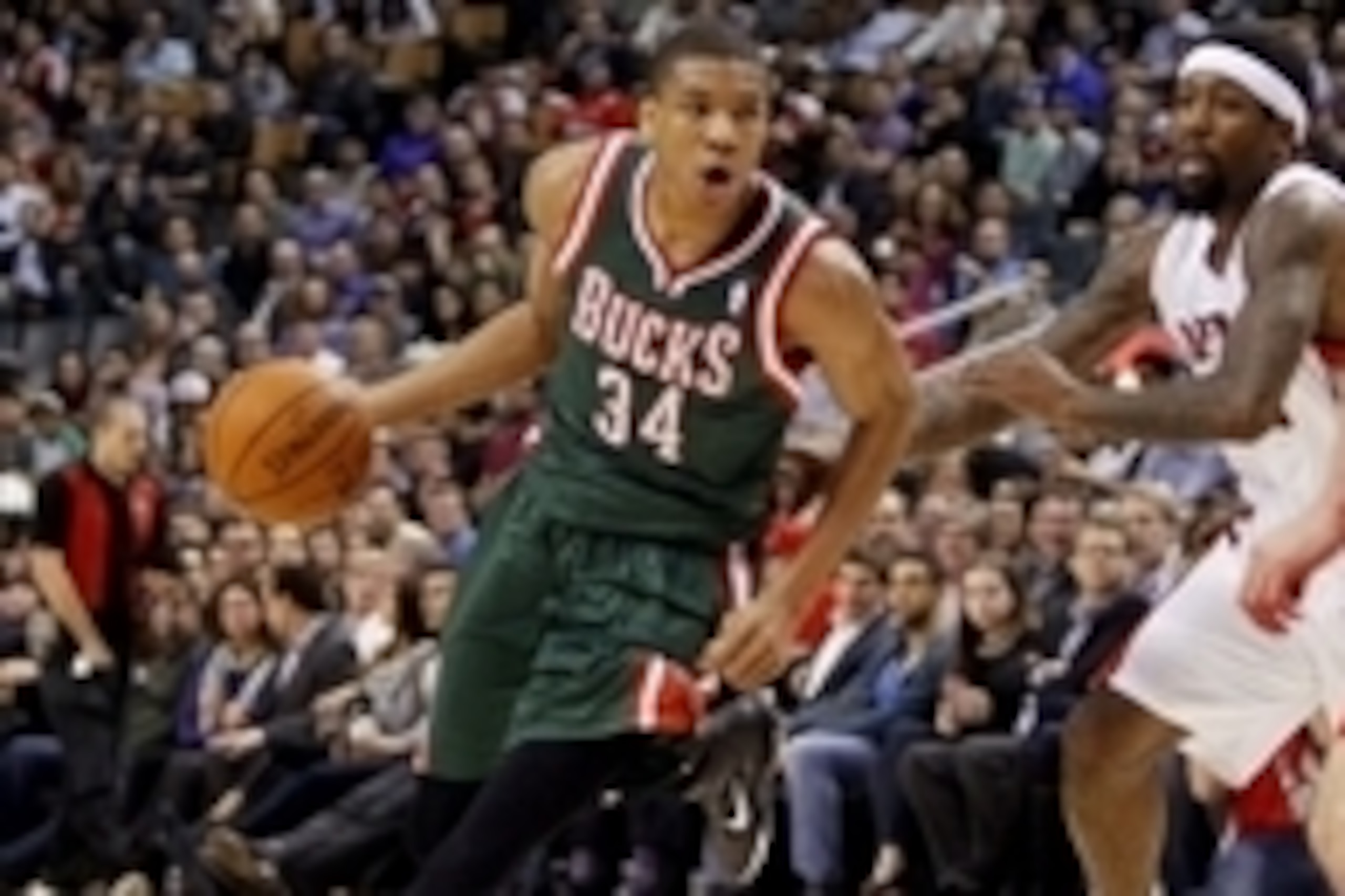 Apr 14, 2014; Toronto, Ontario, CAN; Milwaukee Bucks guard-forward Giannis Antetokounmpo (34) drives to the net against Toronto Raptors guard-forward John Salmons (25) at the Air Canada Centre. Toronto defeated Milwaukee 110-100. Mandatory Credit: John E.
