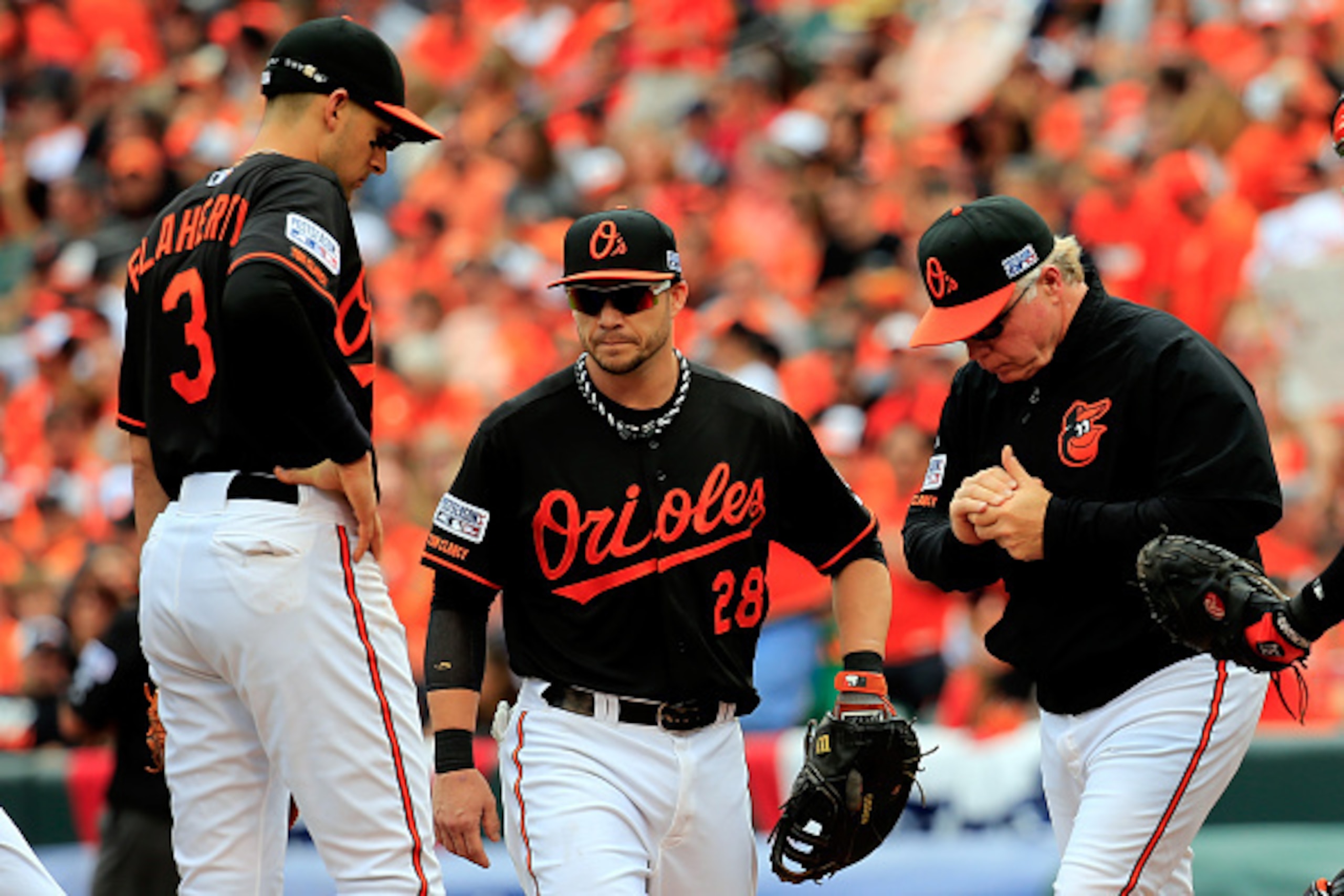 BALTIMORE, MD - OCTOBER 03: Manager Buck Showalter #26 of the Baltimore Orioles walks to the mound for a pitching change in the fourth inning against the Detroit Tigers during Game Two of the American League Division Series at Oriole Park at Camden Yards BALTIMORE, MD - OCTOBER 03: Manager Buck Showalter #26 of the Baltimore Orioles walks to the mound for a pitching change in the fourth inning against the Detroit Tigers during Game Two of the American League Division Series at Oriole Park at Camden Yards