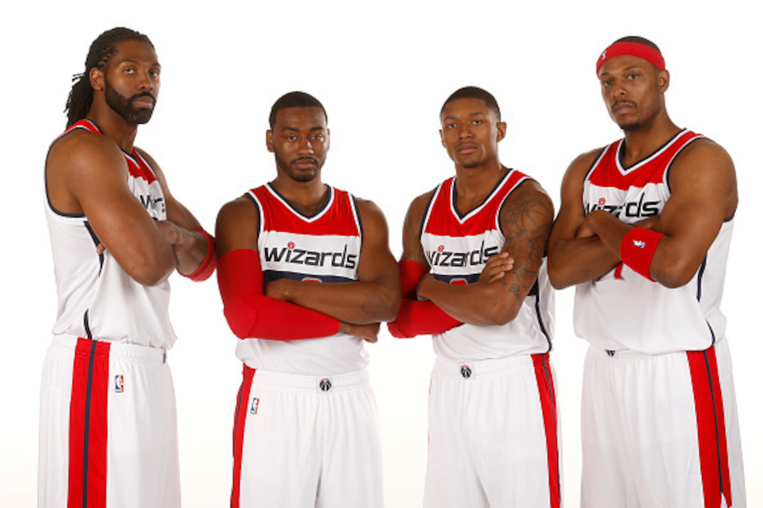 WASHINGTON D.C. - SEPTEMBER 29: (L to R) Nene #42, John Wall #2, Bradley Beal #3 and Paul Pierce #34 of the Washington Wizards pose for a portrait during Media Day at the Verizon Center on September 29, 2014 in Washington D.C. NOTE TO USER: User expressly