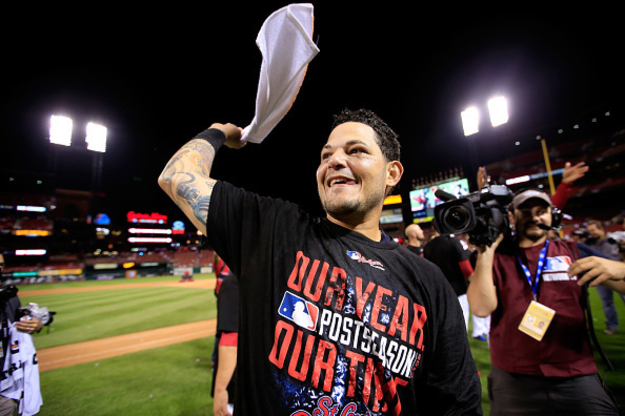 ST LOUIS, MO - OCTOBER 07:  Yadier Molina #4 of the St. Louis Cardinals celebrates after defeating the Los Angeles Dodgers in Game Four of the National League Divison Series at Busch Stadium on October 7, 2014 in St Louis, Missouri.  (Photo by Jamie Squir