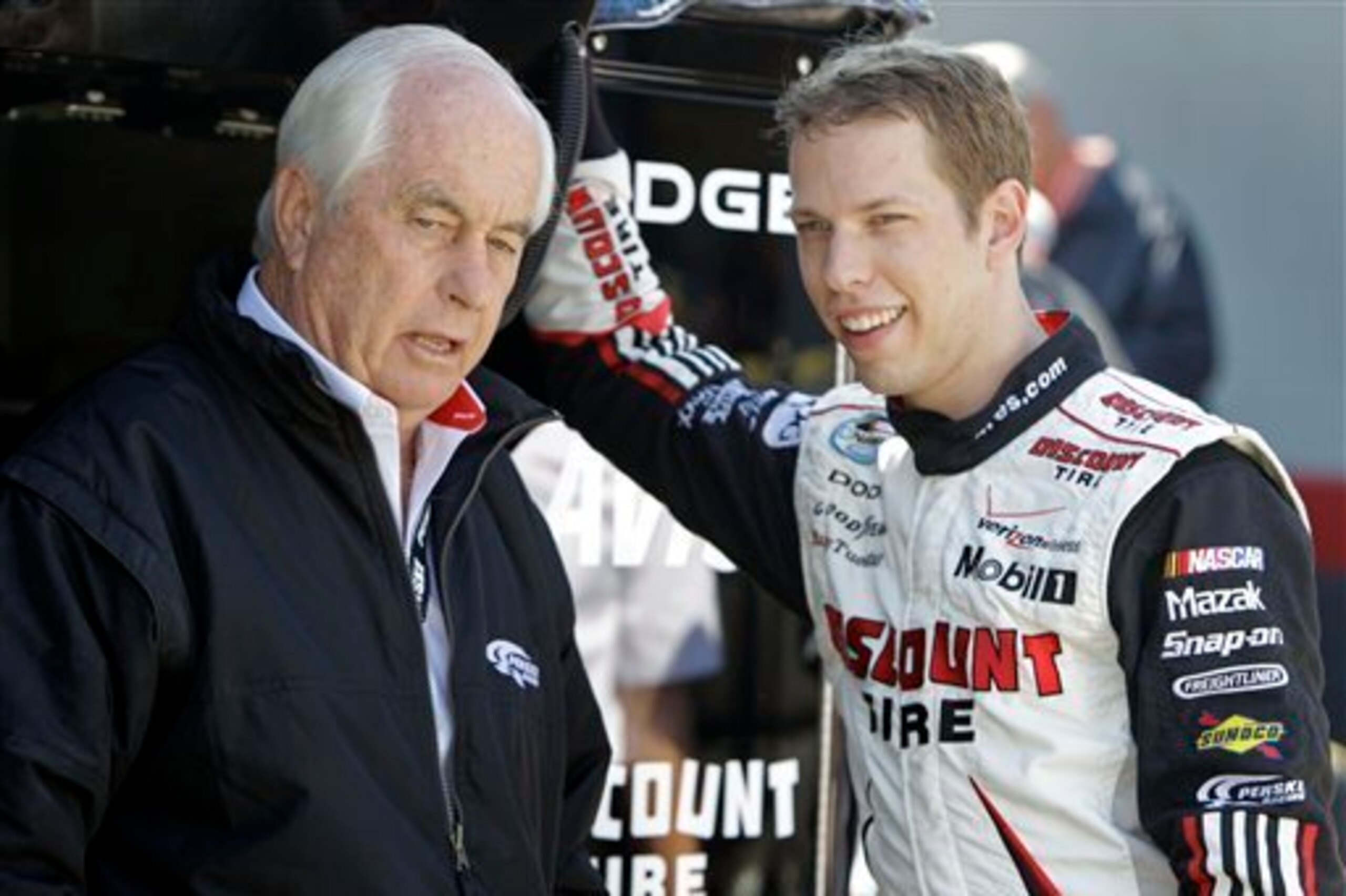 Roger Penske (left) says Brad Keselowski was instrumental in getting Joey Logano on board at Team Penske.