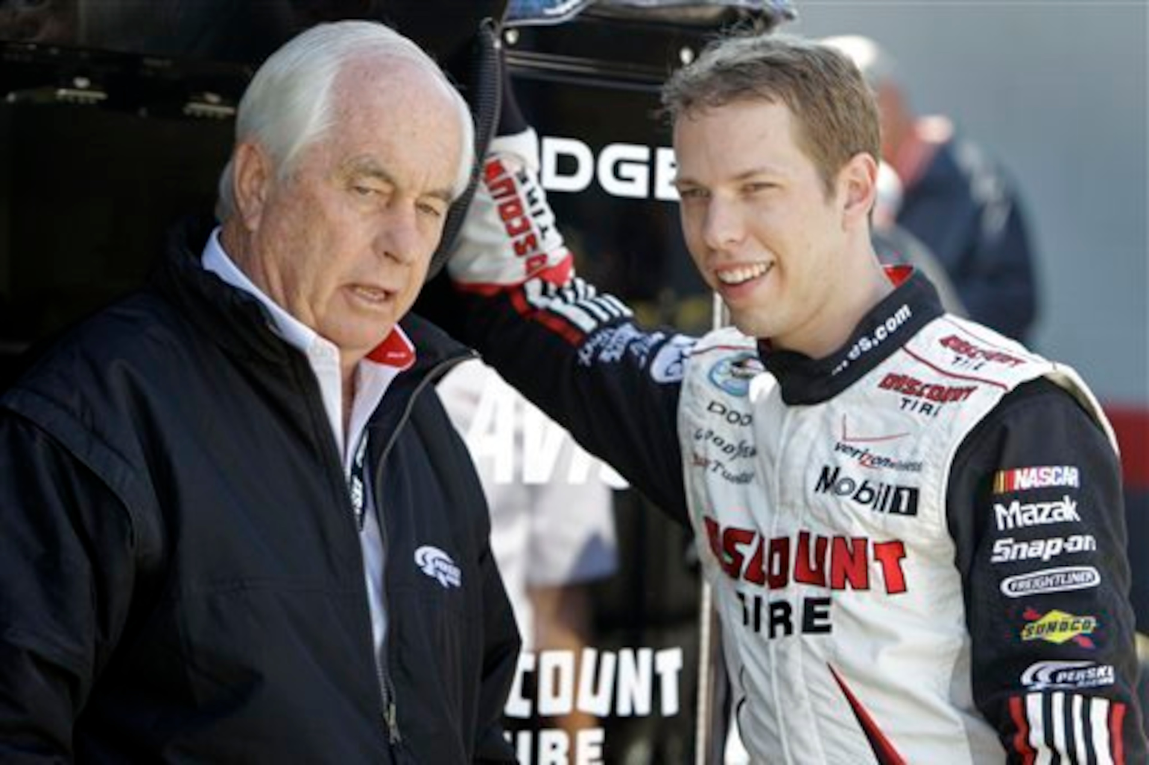 Roger Penske (left) says Brad Keselowski was instrumental in getting Joey Logano on board at Team Penske.