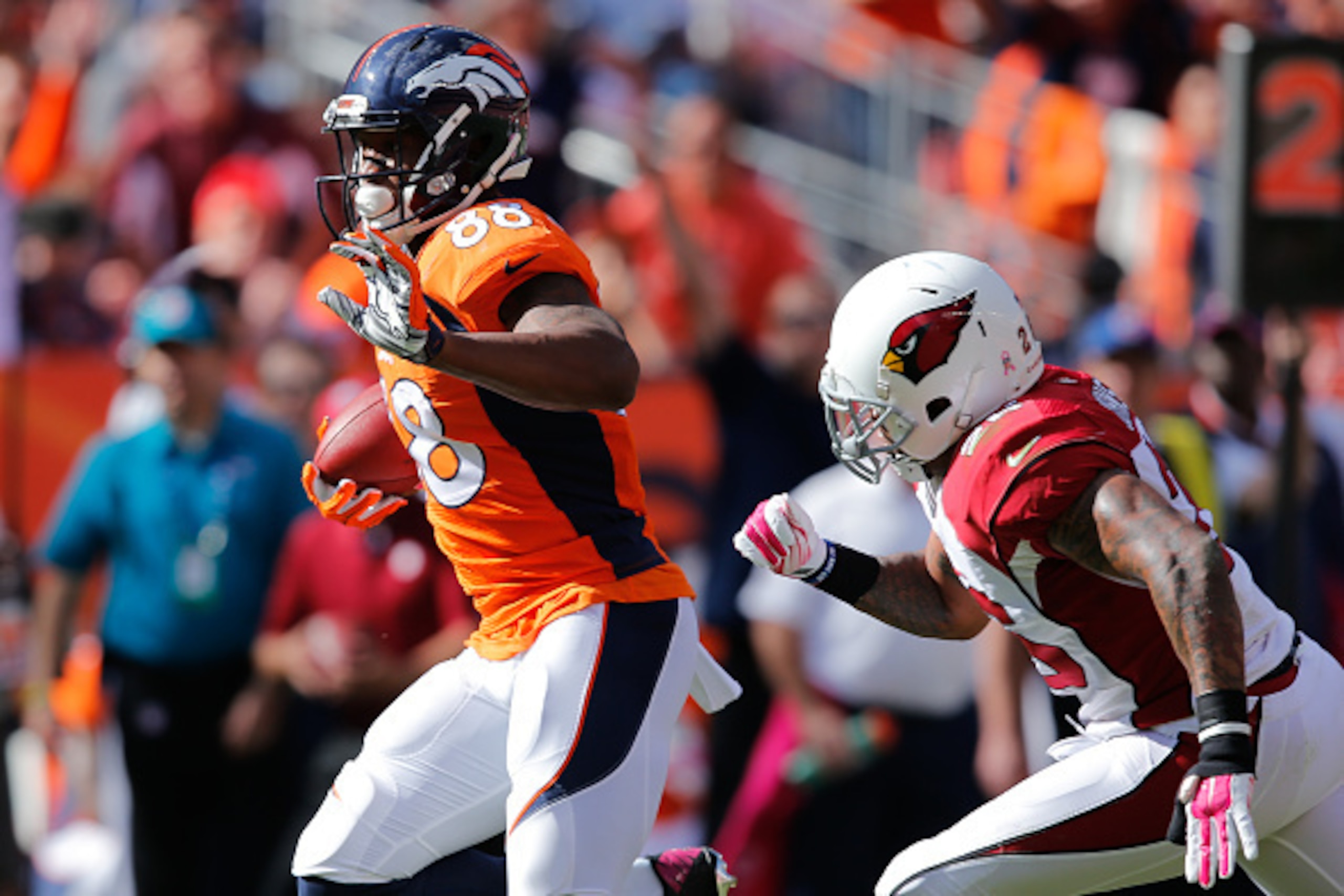 DENVER, CO - OCTOBER 5: Wide receiver Demaryius Thomas #88 of the Denver Broncos runs on his way to scoring a 31 yard second quarter touchdown during a game at Sports Authority Field at Mile High on October 5, 2014 in Denver, Colorado. (Photo by Doug P DENVER, CO - OCTOBER 5: Wide receiver Demaryius Thomas #88 of the Denver Broncos runs on his way to scoring a 31 yard second quarter touchdown during a game at Sports Authority Field at Mile High on October 5, 2014 in Denver, Colorado. (Photo by Doug P