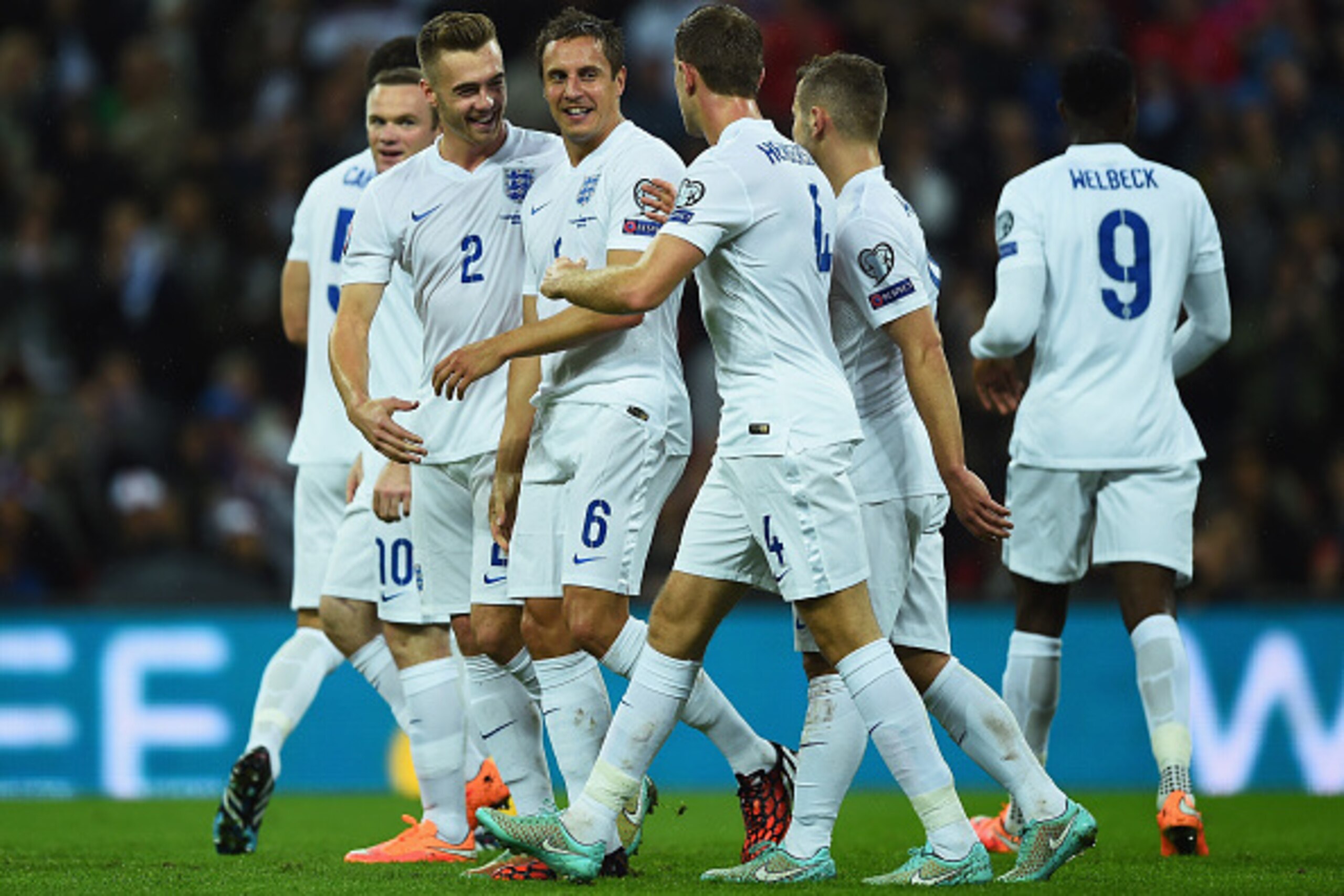 LONDON, ENGLAND - OCTOBER 09:  Phil Jagielka of England (6) celebrates with team mates Calum Chambers (2) and Jordan Henderson (4) as he scores their irst goal during the EURO 2016 Group E Qualifying match between England and San Marino at Wembley Stadium