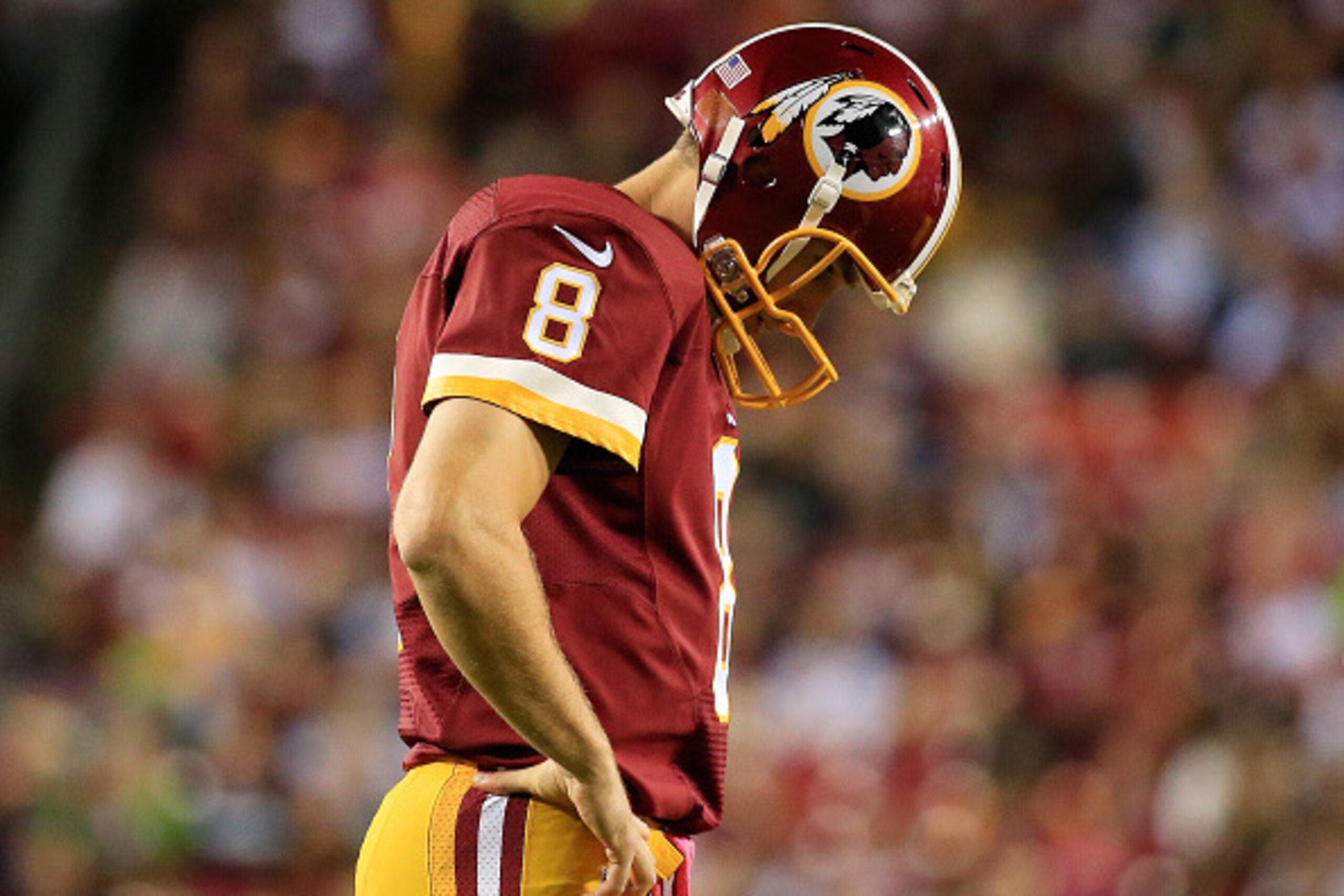 LANDOVER, MD - OCTOBER 06:   Kirk Cousins #8 of the Washington Redskins looks on during a timeout against the Seattle Seahawks at FedExField on October 6, 2014 in Landover, Maryland.  (Photo by Rob Carr/Getty Images)