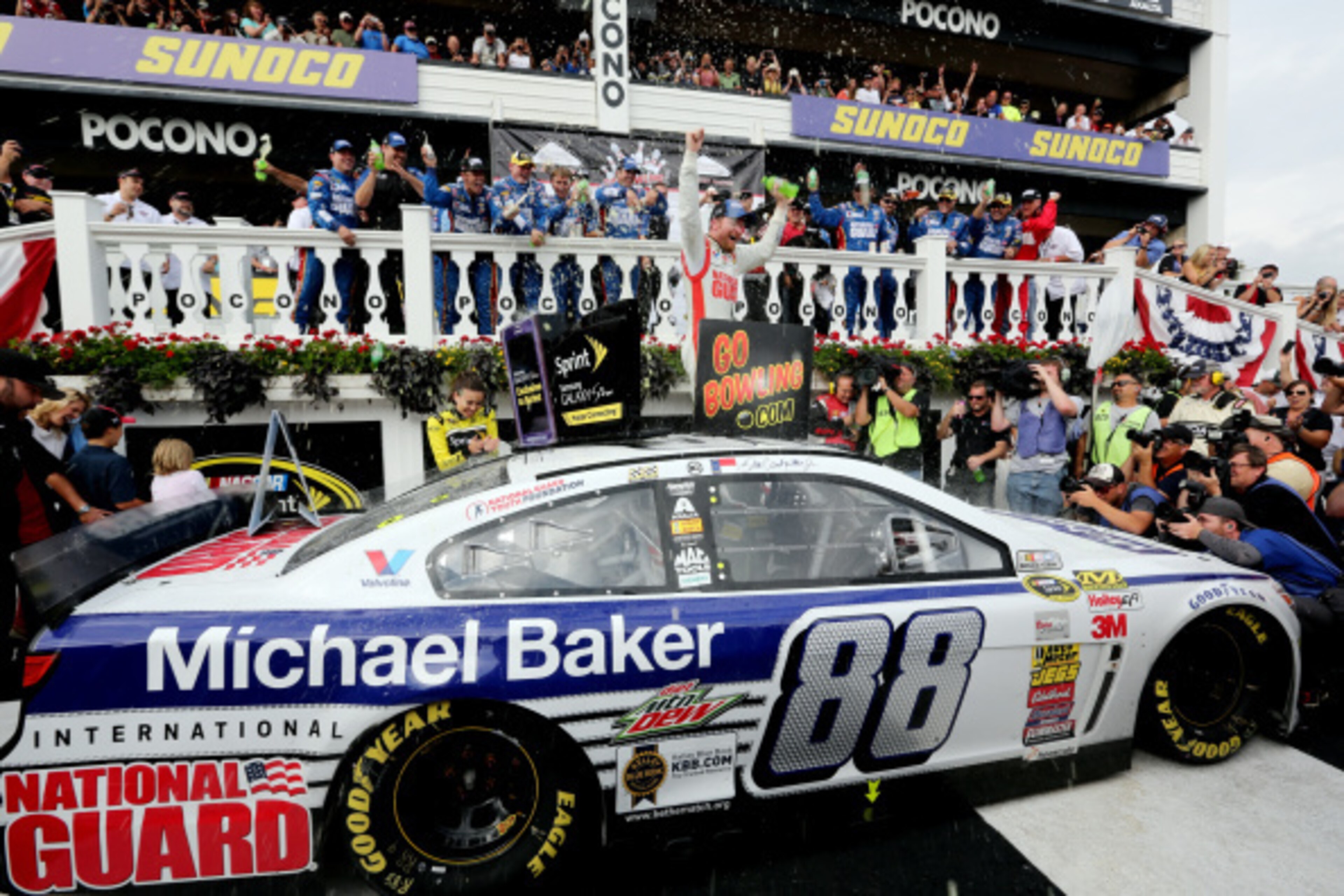 LONG POND, PA - AUGUST 03: Dale Earnhardt Jr., driver of the #88 Michael Baker International Chevrolet, celebrates in Victory Lane after winning the NASCAR Sprint Cup Series GoBowling.com 400 at Pocono Raceway on August 3, 2014 in Long Pond, Pennsylvania LONG POND, PA - AUGUST 03: Dale Earnhardt Jr., driver of the #88 Michael Baker International Chevrolet, celebrates in Victory Lane after winning the NASCAR Sprint Cup Series GoBowling.com 400 at Pocono Raceway on August 3, 2014 in Long Pond, Pennsylvania