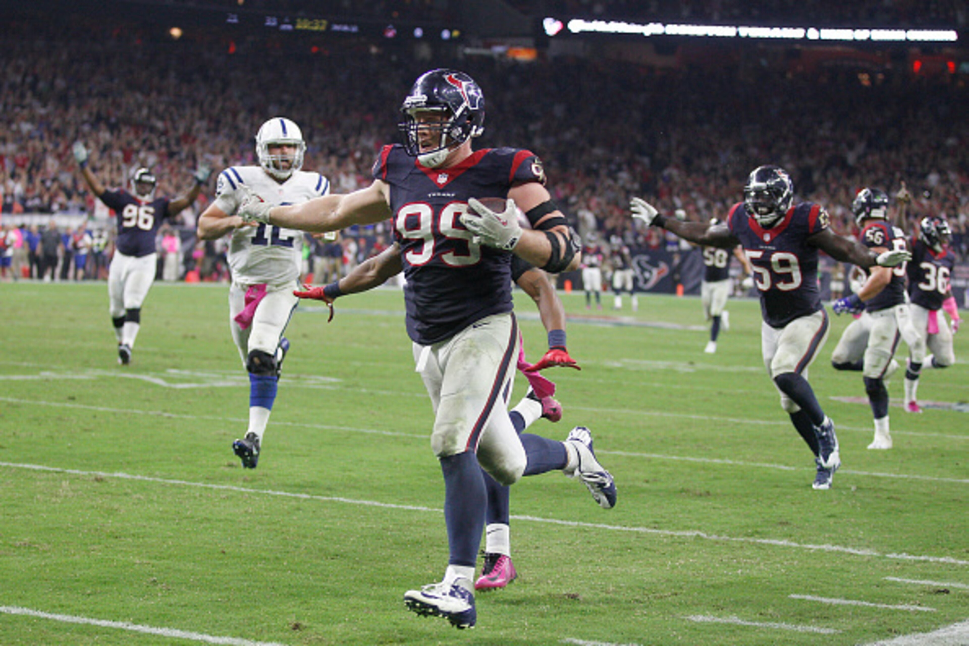 HOUSTON, TX- OCTOBER 09: J.J. Watt #99 of the Houston Texans runs back a Indianapolis Colts fumble for a touchdown in the fourth quarter in a NFL game on October 9, 2014 at NRG Stadium in Houston, Texas. (Photo by Bob Levey/Getty Images)