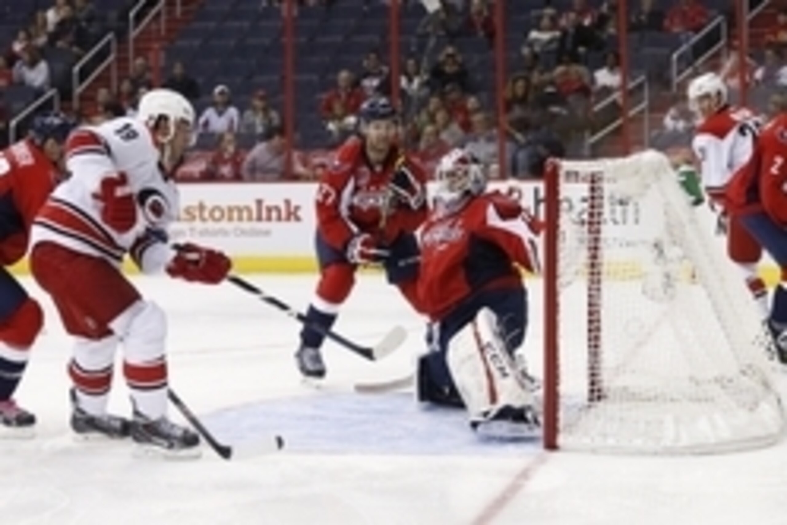 Oct 5, 2014; Washington, DC, USA; Carolina Hurricanes left wing Jiri Tlusty (19) scores a goal on Washington Capitals goalie Braden Holtby (70) in the second period at Verizon Center. Mandatory Credit: Geoff Burke-USA TODAY Sports