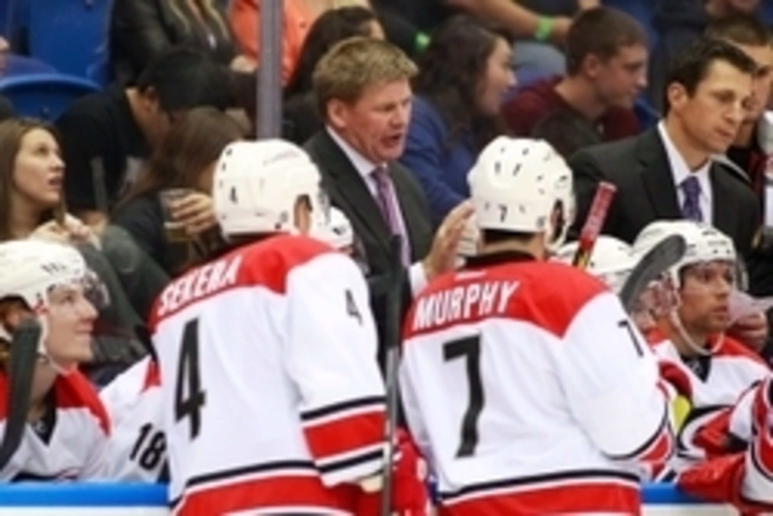 Sep 24, 2014; Uniondale, NY, USA; Carolina Hurricanes head coach Bill Peters gives instructions during a third period timeout against the New York Islanders at Nassau Veterans Memorial Coliseum. The Hurricanes defeated the Islanders 4-2. Mandatory Credit: