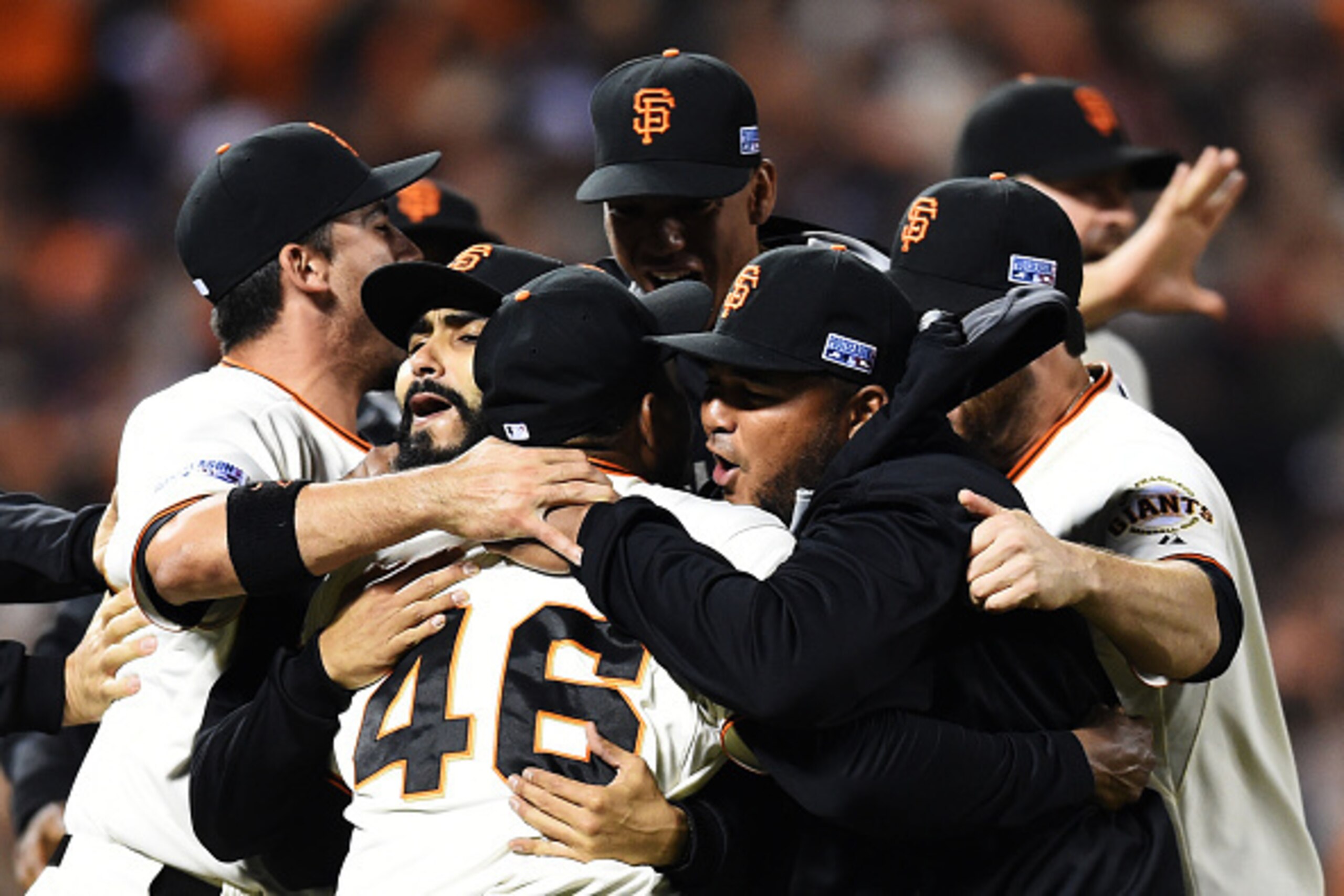 SAN FRANCISCO, CA - OCTOBER 07:  Santiago Casilla #46 of the San Francisco Giants celebrates with teammates after the final out of their 3 to 2 win over the Washington Nationals during Game Four of the National League Division Series at AT&T Park on Octob