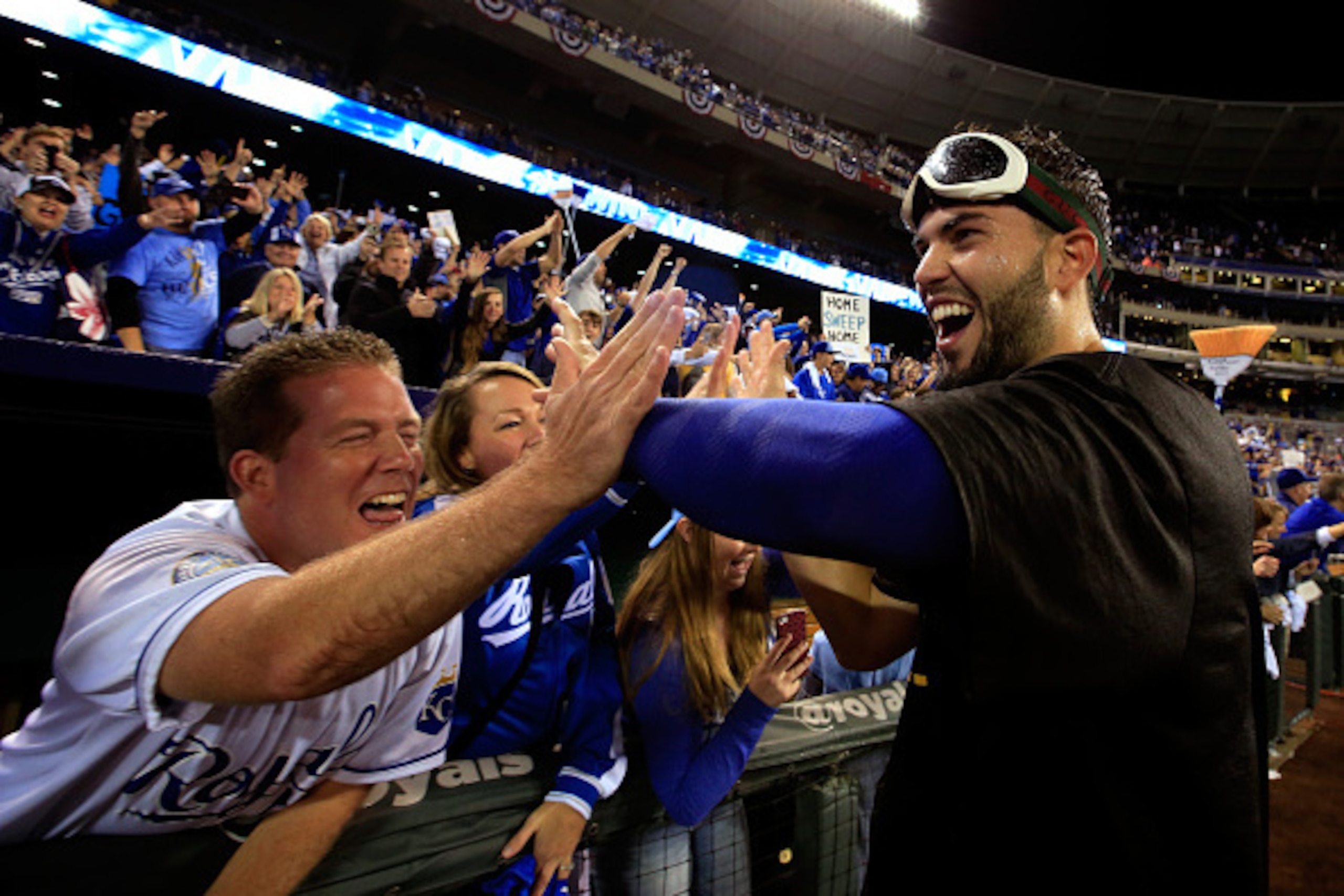 KANSAS CITY, MO - OCTOBER 05:  Eric Hosmer #35 of the Kansas City Royals celebrates with fans after the Royals defeated the Los Angeles Angels 9-3 to win game 3 of the American League Division Series  at Kauffman Stadium on October 5, 2014 in Kansas City,