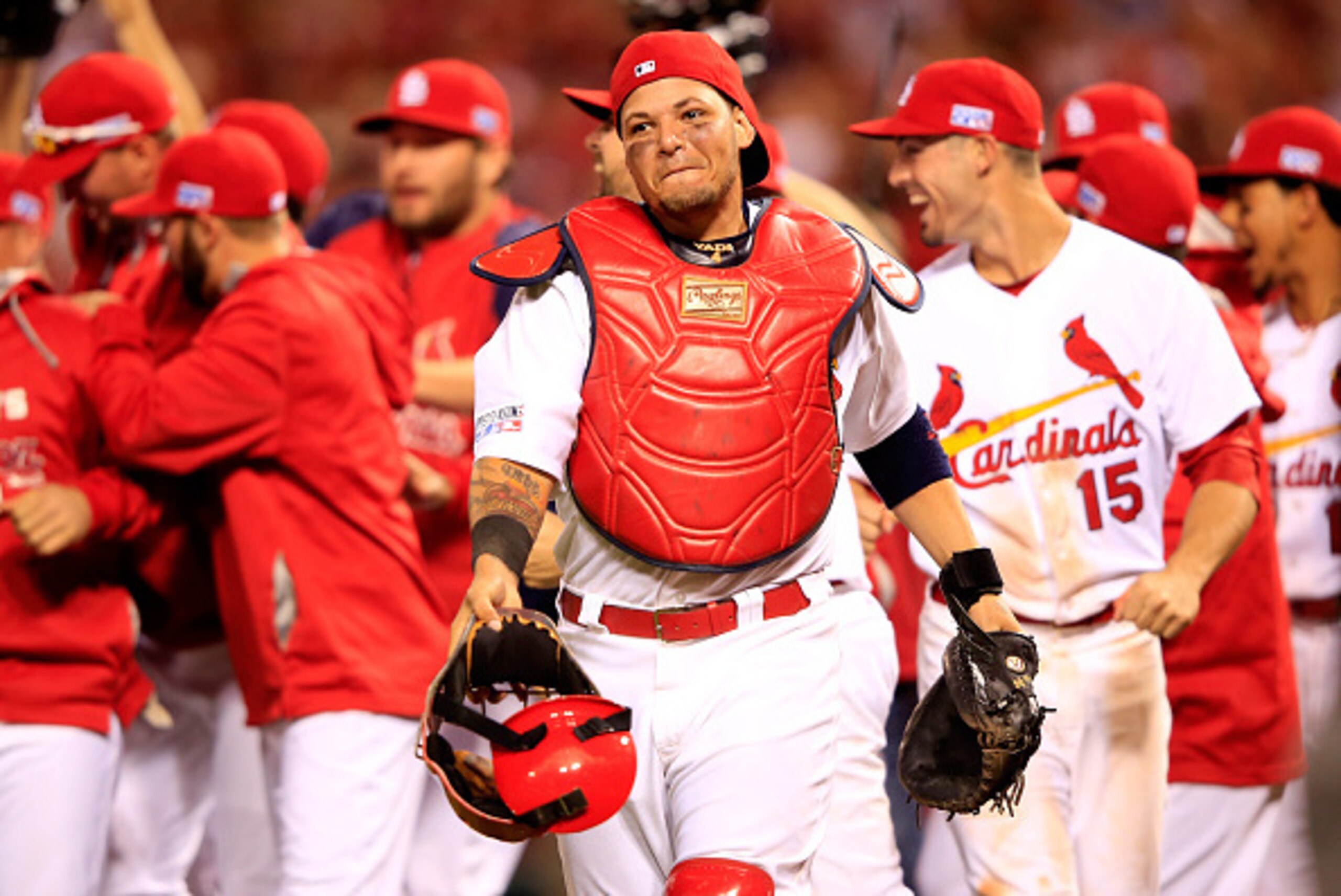 ST LOUIS, MO - OCTOBER 07: Yadier Molina #4 of the St. Louis Cardinals celebrates with teammates after defeating the Los Angeles Dodgers in Game Four of the National League Divison Series at Busch Stadium on October 7, 2014 in St Louis, Missouri.  (Photo 