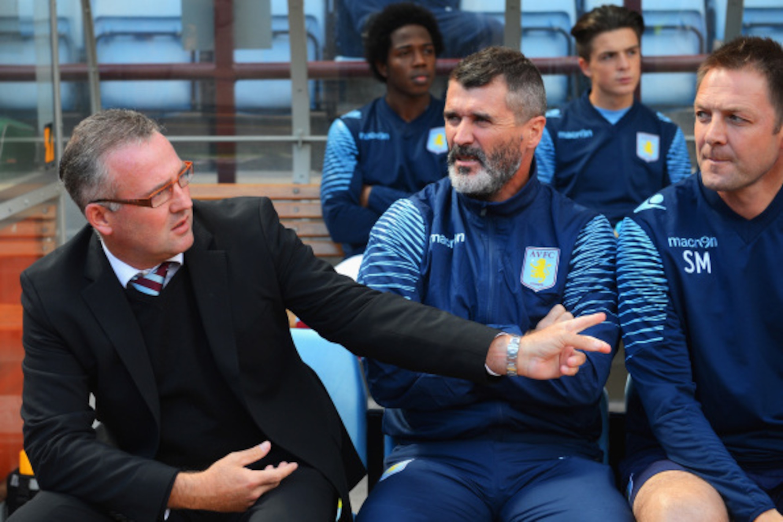 BIRMINGHAM, ENGLAND - AUGUST 23:  Manager Paul Lambert (L) of Aston Villa talks to assistant Roy Keane during the Barclays Premier League match between Aston Villa and Newcastle United at Villa Park on August 23, 2014 in Birmingham, England.  (Photo by Mi