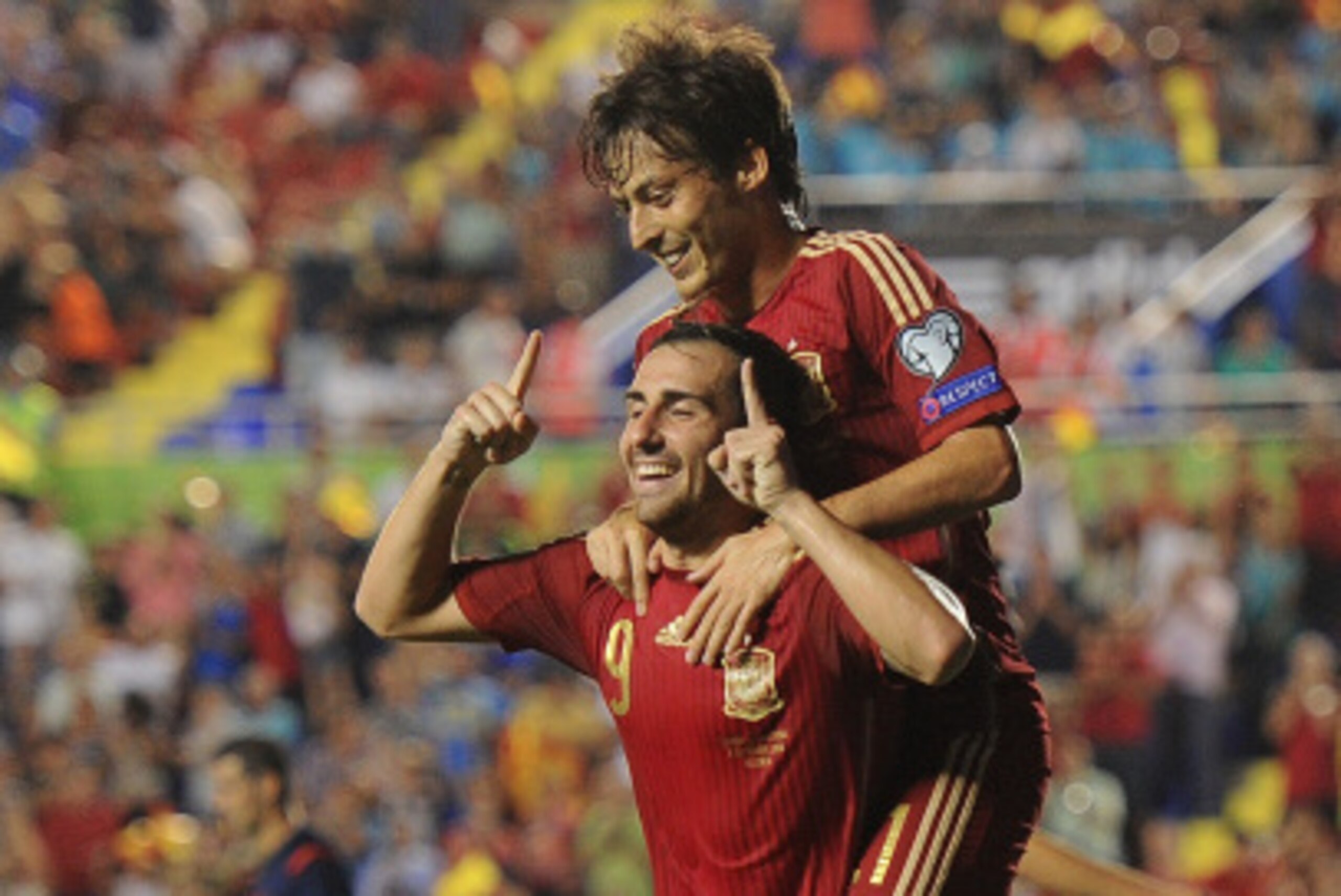VALENCIA, SPAIN - SEPTEMBER 08: Paco Alcacer celebrates with David Silva after scoring Spain's 2nd goal during the UEFA EURO 2016 Group C Qualifier between Spain and FYR of Macedonia at Estadio Ciutat de Valencia on September 8, 2014 in Valencia, Spain.  