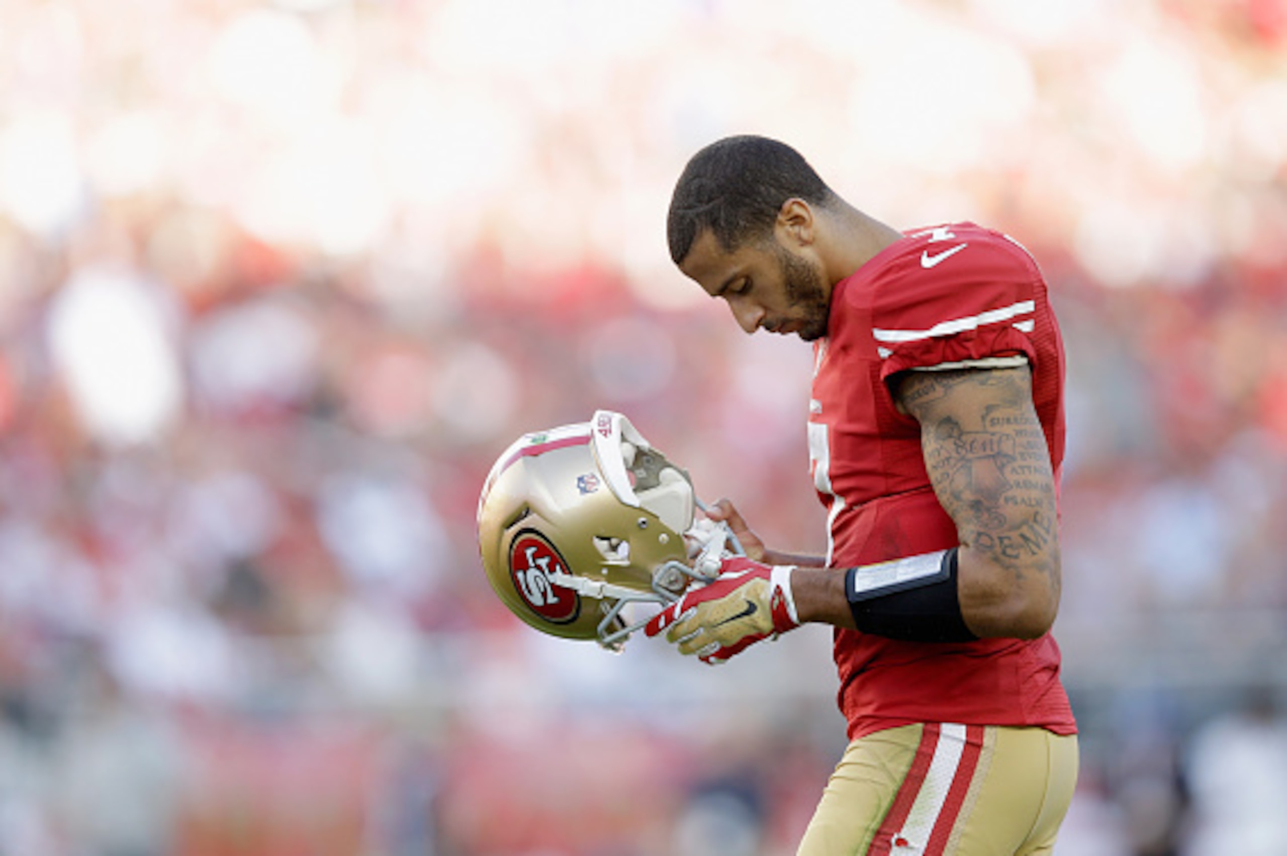 SANTA CLARA, CA - SEPTEMBER 14:  Quarterback Colin Kaepernick #7 of the San Francisco 49ers walks back to the sidelines during their game against the Chicago Bears at Levi's Stadium on September 14, 2014 in Santa Clara, California.  (Photo by Ezra Shaw/Ge