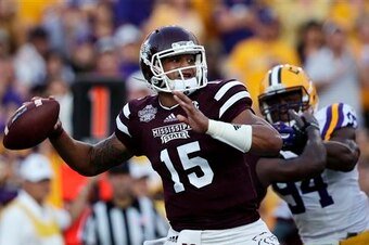 LSU defensive end Danielle Hunter pursues Mississippi State quarterback Dak Prescott.