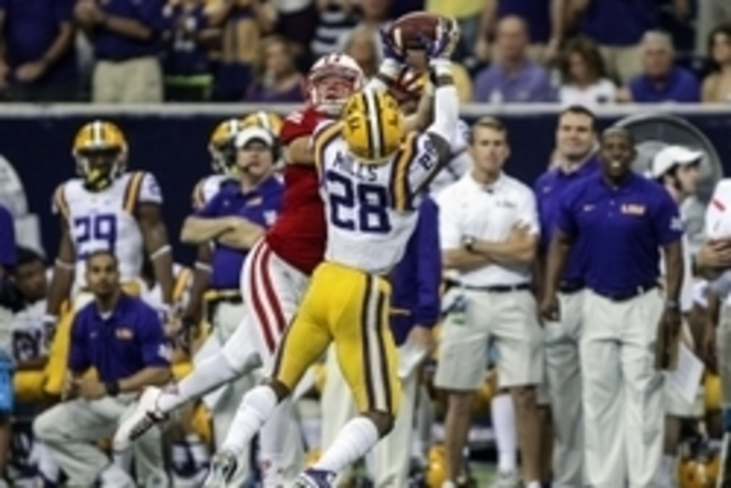 Aug 30, 2014; Houston, TX, USA; LSU Tigers safety Jalen Mills (28) intercepts a pass intended for Wisconsin Badgers tight end Troy Fumagalli (48) during the fourth quarter at NRG Stadium. The Tigers defeated the Badgers 28-24. Mandatory Credit: Troy Taorm