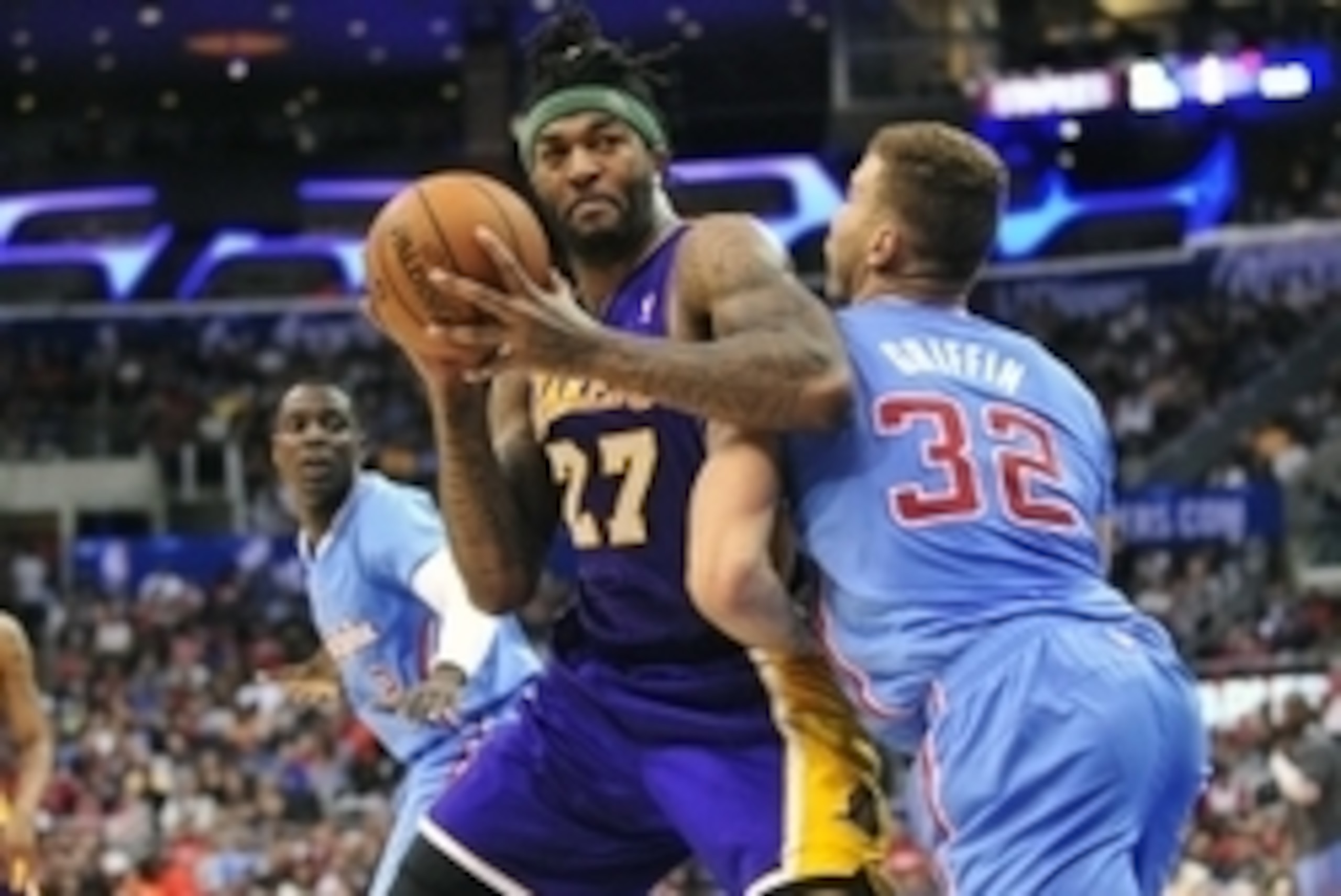 April 6, 2014; Los Angeles, CA, USA; Los Angeles Lakers forward Jordan Hill (27) moves the ball against Los Angeles Clippers forward Blake Griffin (32) during the first half at Staples Center. Mandatory Credit: Gary A. Vasquez-USA TODAY Sports