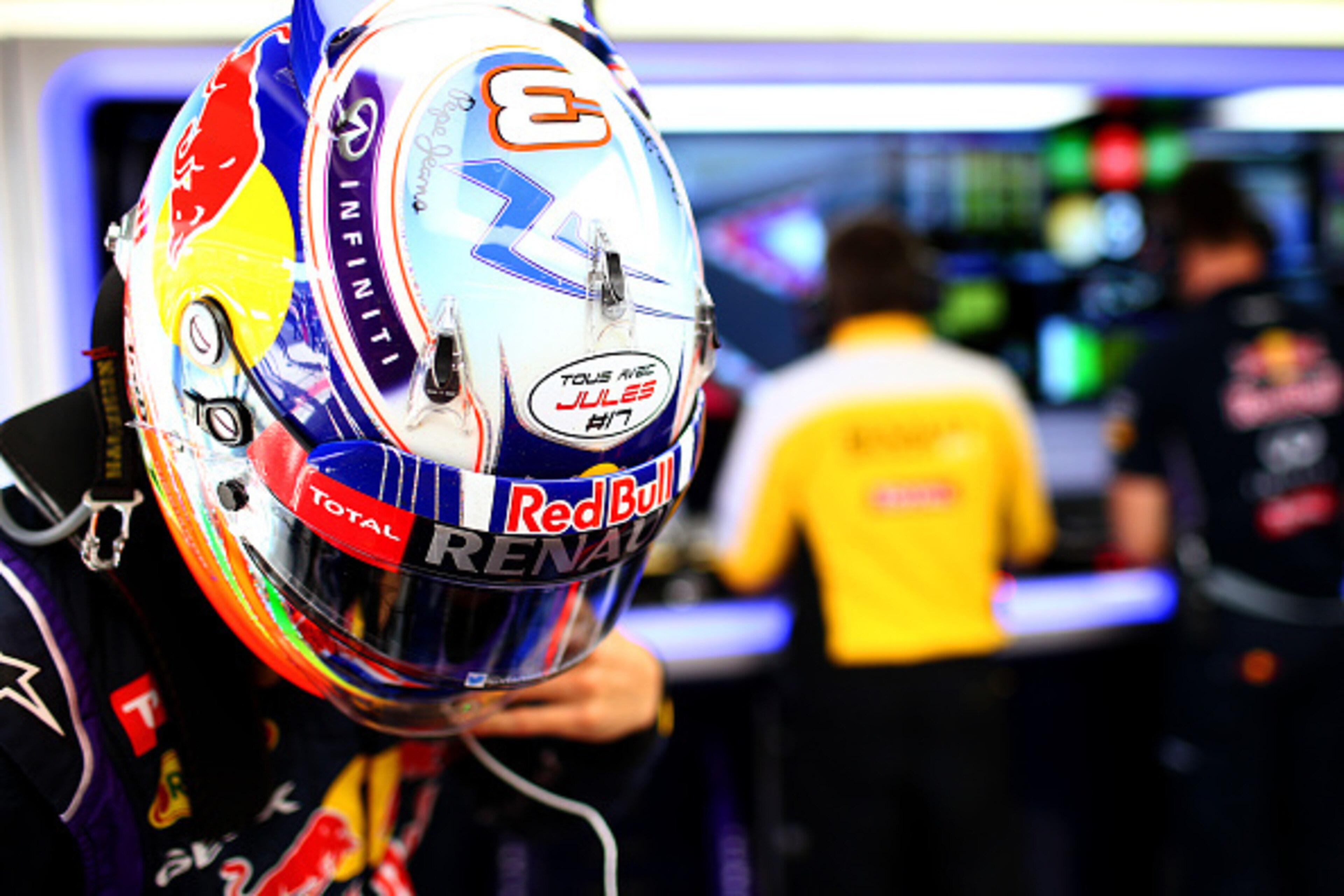 SOCHI, RUSSIA - OCTOBER 10:  Daniel Ricciardo of Australia and Infiniti Red Bull Racing's helmet displaying the message 'tous avec Jules #17' in support of Jules Bianchi of France and Marussia following his accident at Suzuka during practice ahead of the 