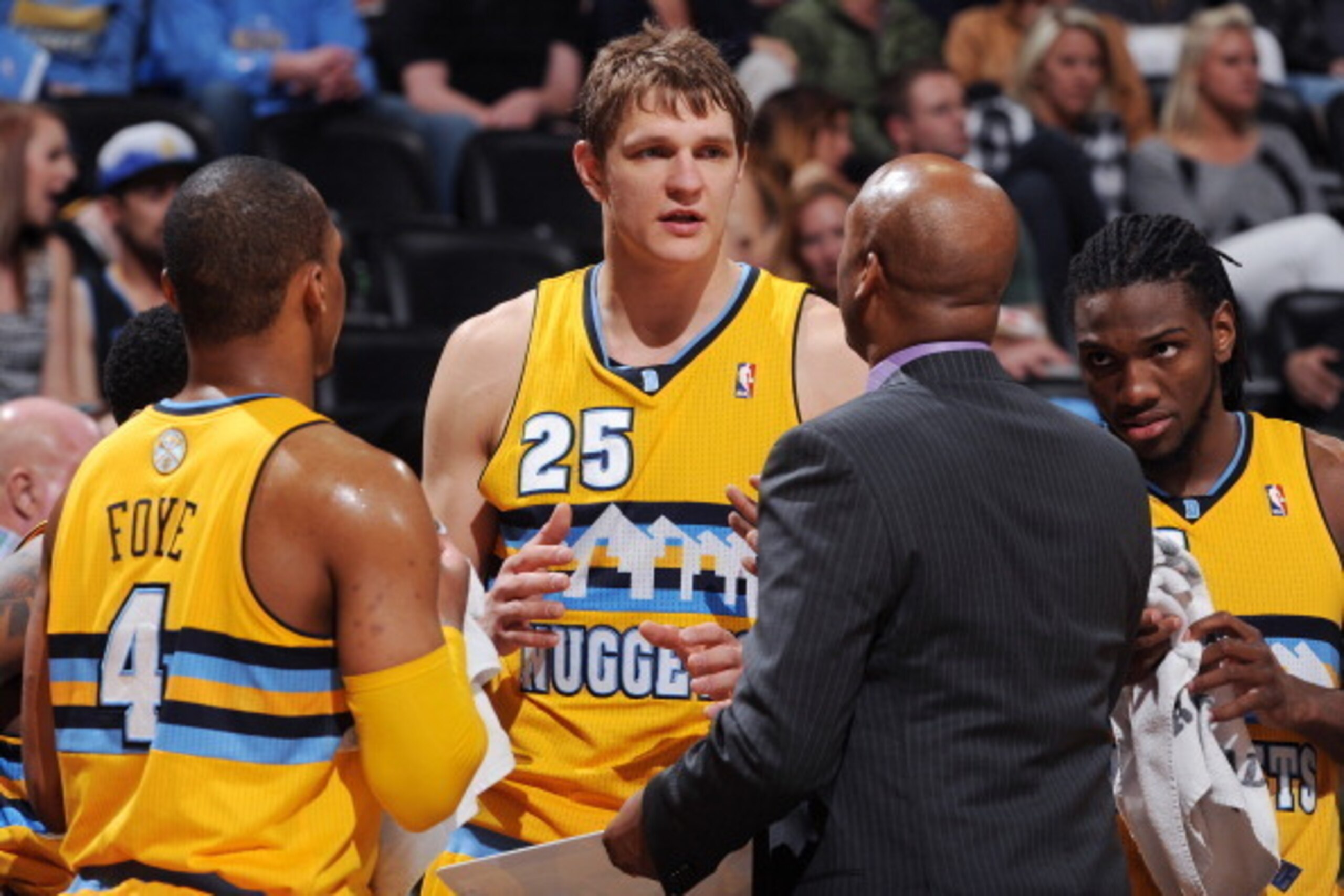 DENVER, CO - APRIL 12:  Timofey Mozgov #25 of the Denver Nuggets huddles up his team against the Utah Jazz on April 12, 2014 at the Pepsi Center in Denver, Colorado. NOTE TO USER: User expressly acknowledges and agrees that, by downloading and/or using th