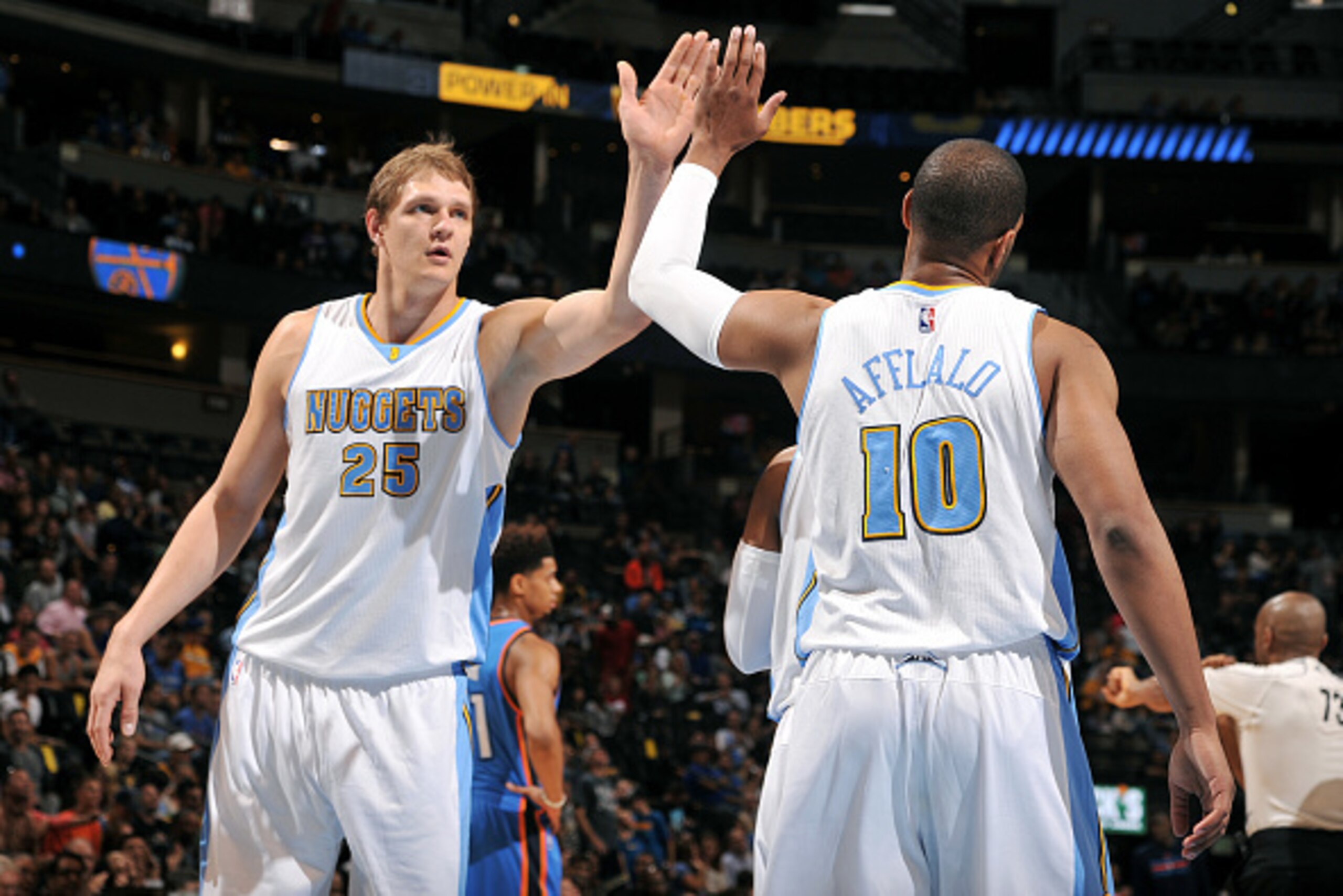 DENVER, CO - October 8: Timofey Mozgov #25 and Aaron Afflalo #10 of the Denver Nuggets celebrates during a game against the Oklahoma City Thunder on October 8, 2014 at the Pepsi Center in Denver, Colorado. NOTE TO USER: User expressly acknowledges and agr