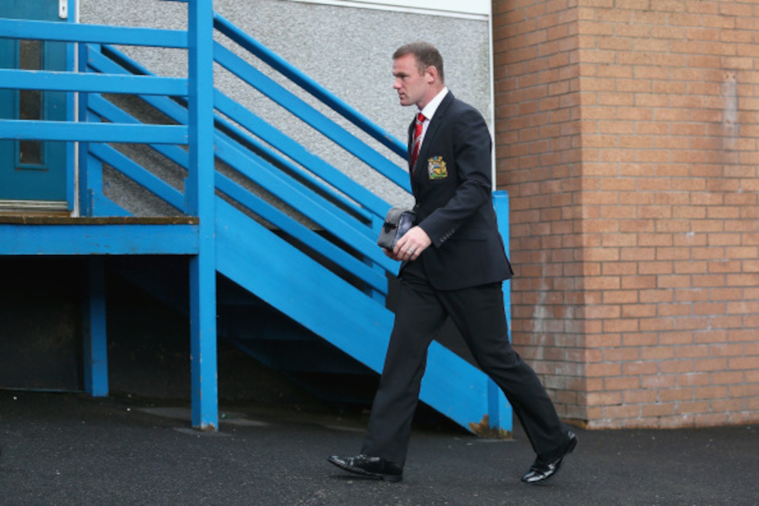 BURNLEY, ENGLAND - AUGUST 30:  Captain Wayne Rooney of Manchester United arrives ahead of the Barclays Premier League match between Burnley and Manchester United at Turf Moor on August 30, 2014 in Burnley, England.  (Photo by Clive Brunskill/Getty Images)