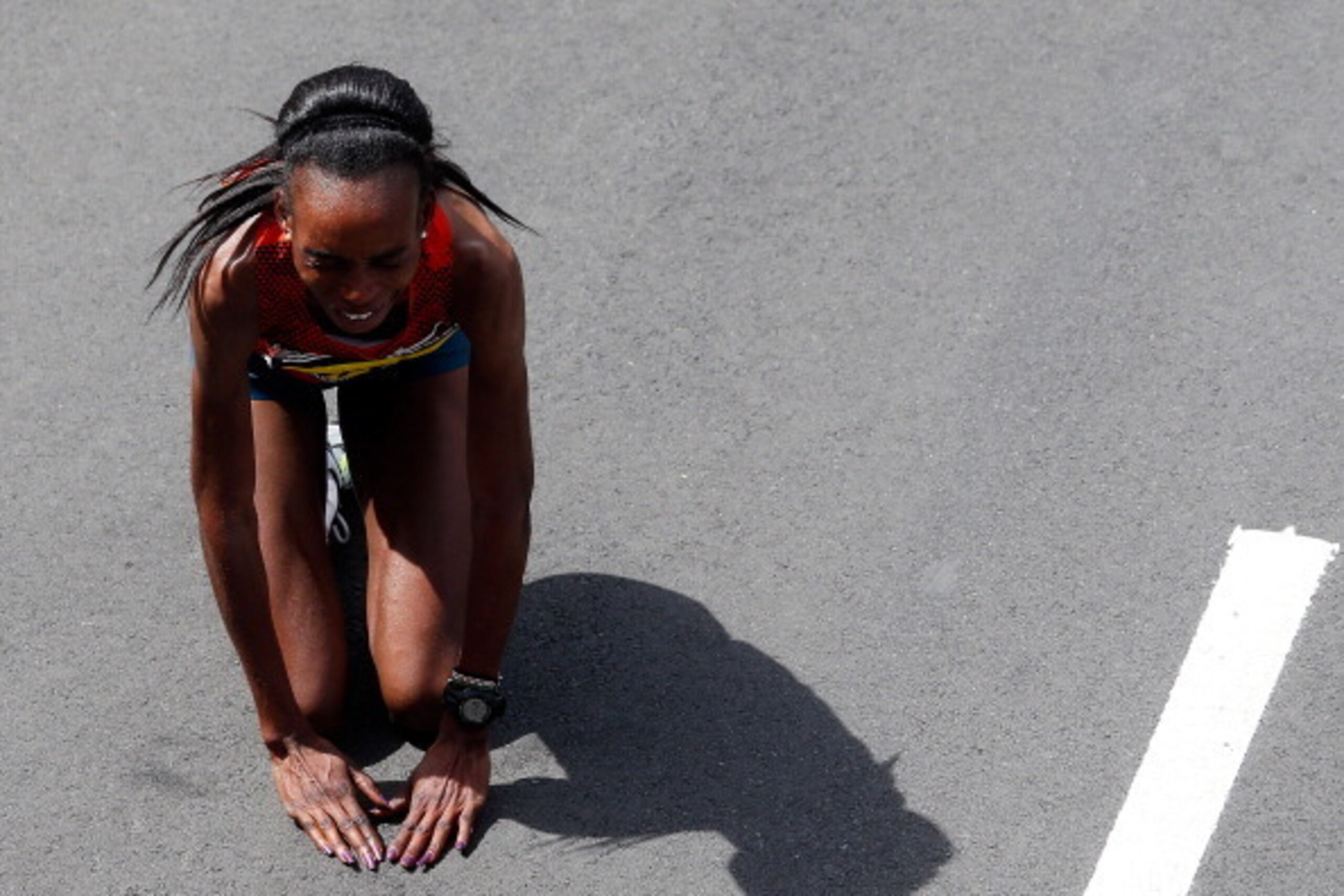 BOSTON, MA - APRIL 21:  Rita Jeptoo of Kenya celebrates after winning the 118th Boston Marathon on April 21, 2014 in Boston, Massachusetts.  (Photo by Jim Rogash/Getty Images)