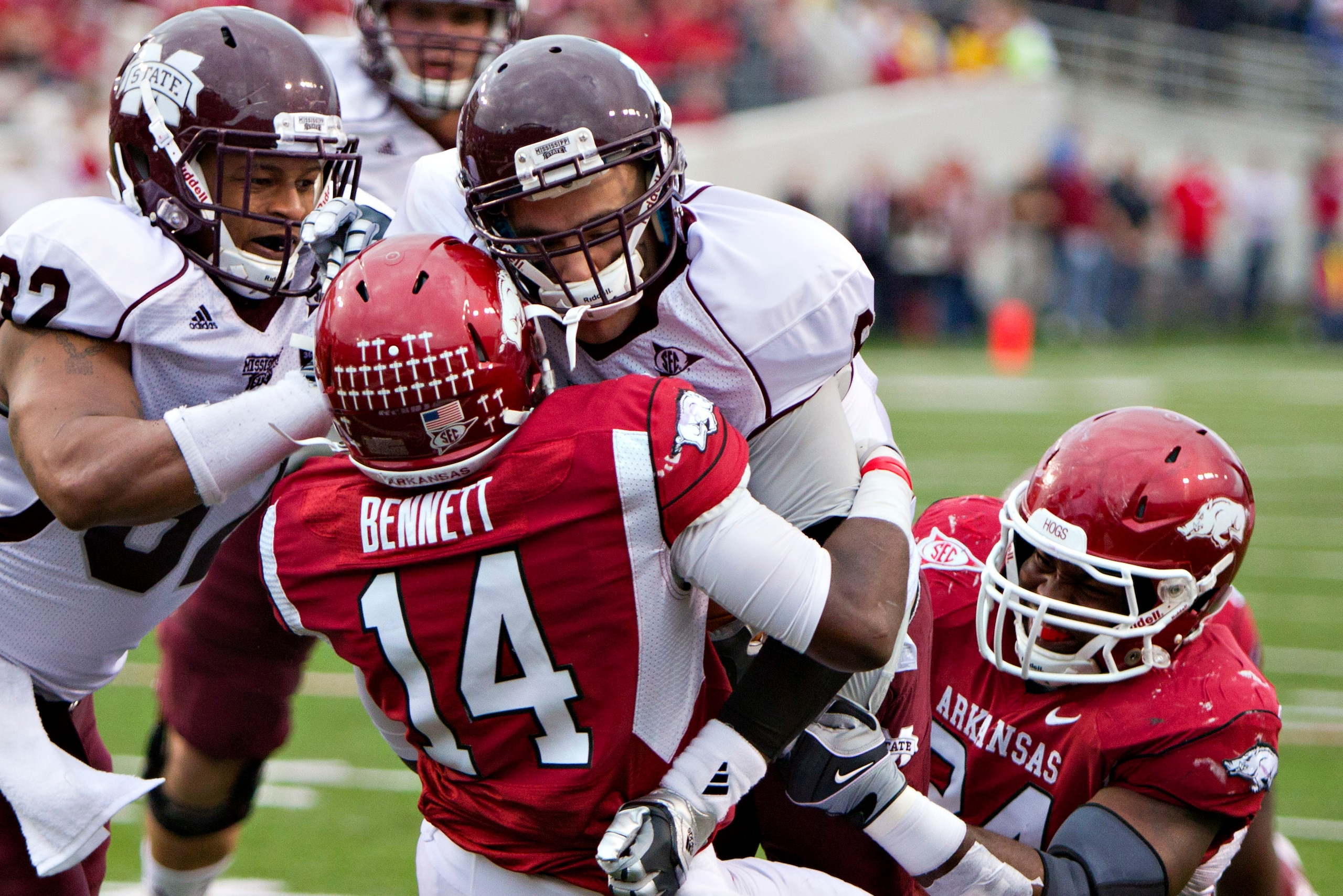 Dylan Favre carries two Arkansas defenders over the goal line.