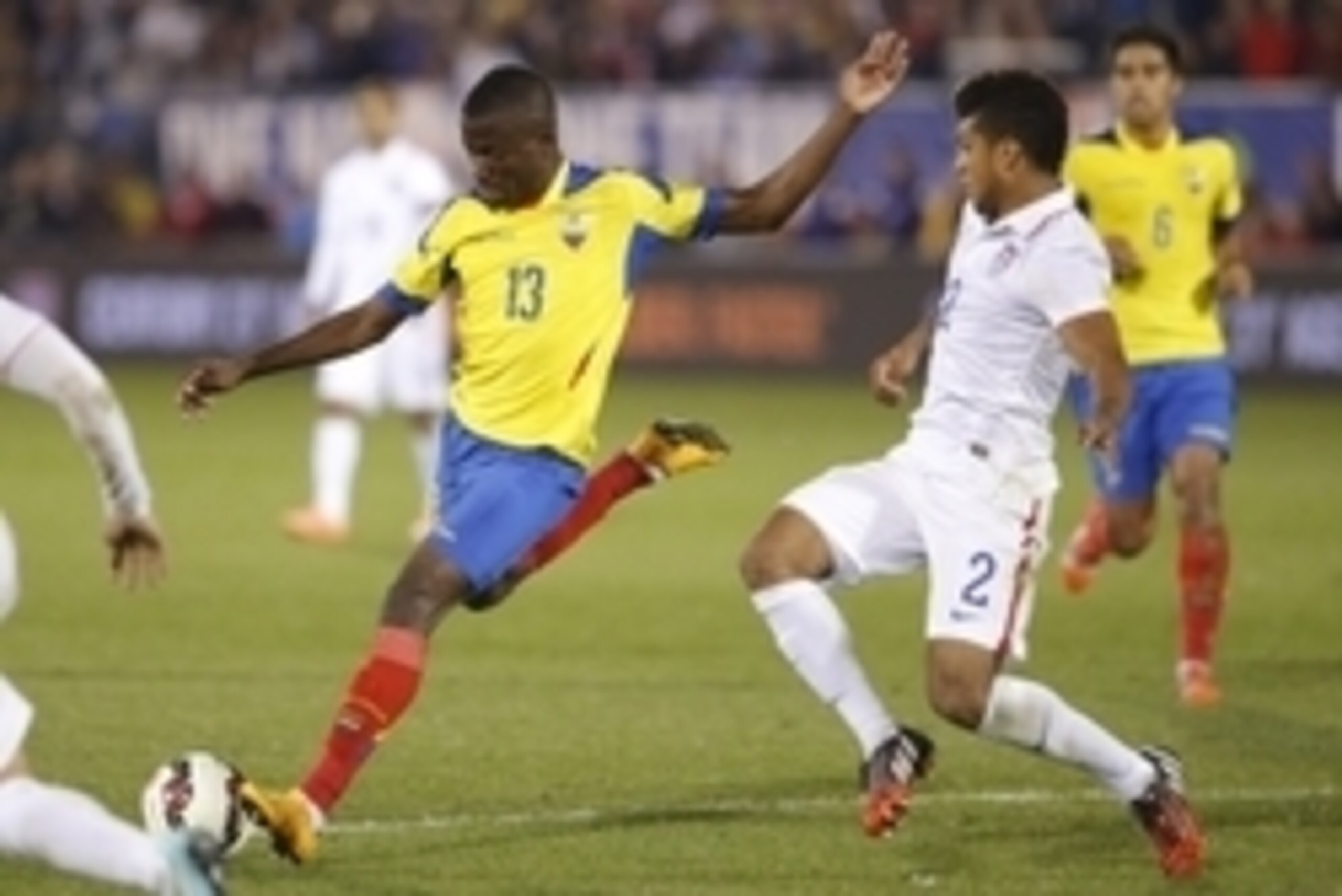 Oct 10, 2014; Hartford, CT, USA; Ecuador forward Enner Valencia (13) works the ball against USA defensemen DeAndre Yedlin (2) in the second half at Rentschler Field. Mandatory Credit: David Butler II-USA TODAY Sports
