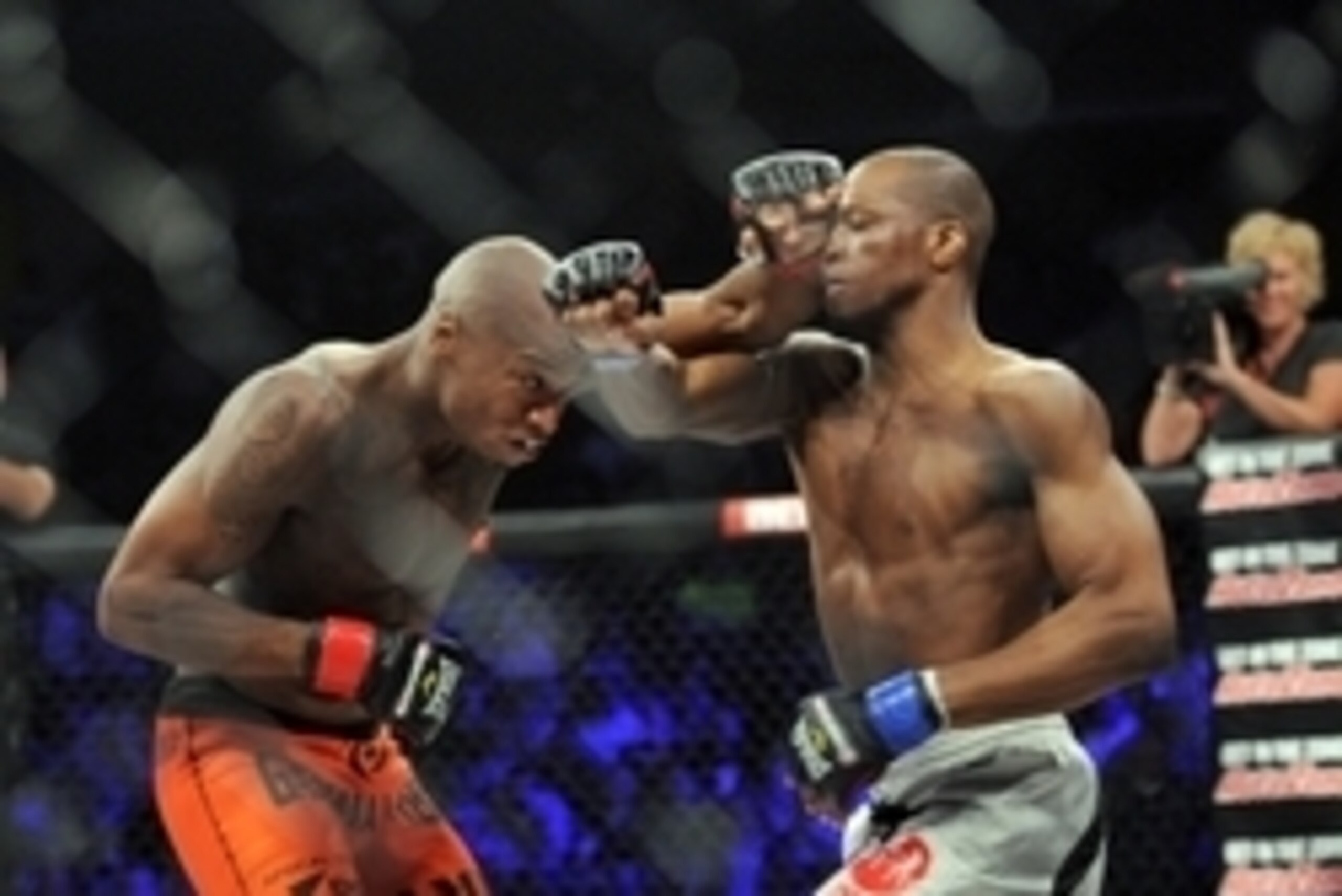 May 17, 2014; Southaven, MS, USA; Ricky Rainey (red gloves) fights against  Michael Page (blue gloves) during BFC 120 at Landers Center. Mandatory Credit: Justin Ford-USA TODAY Sports