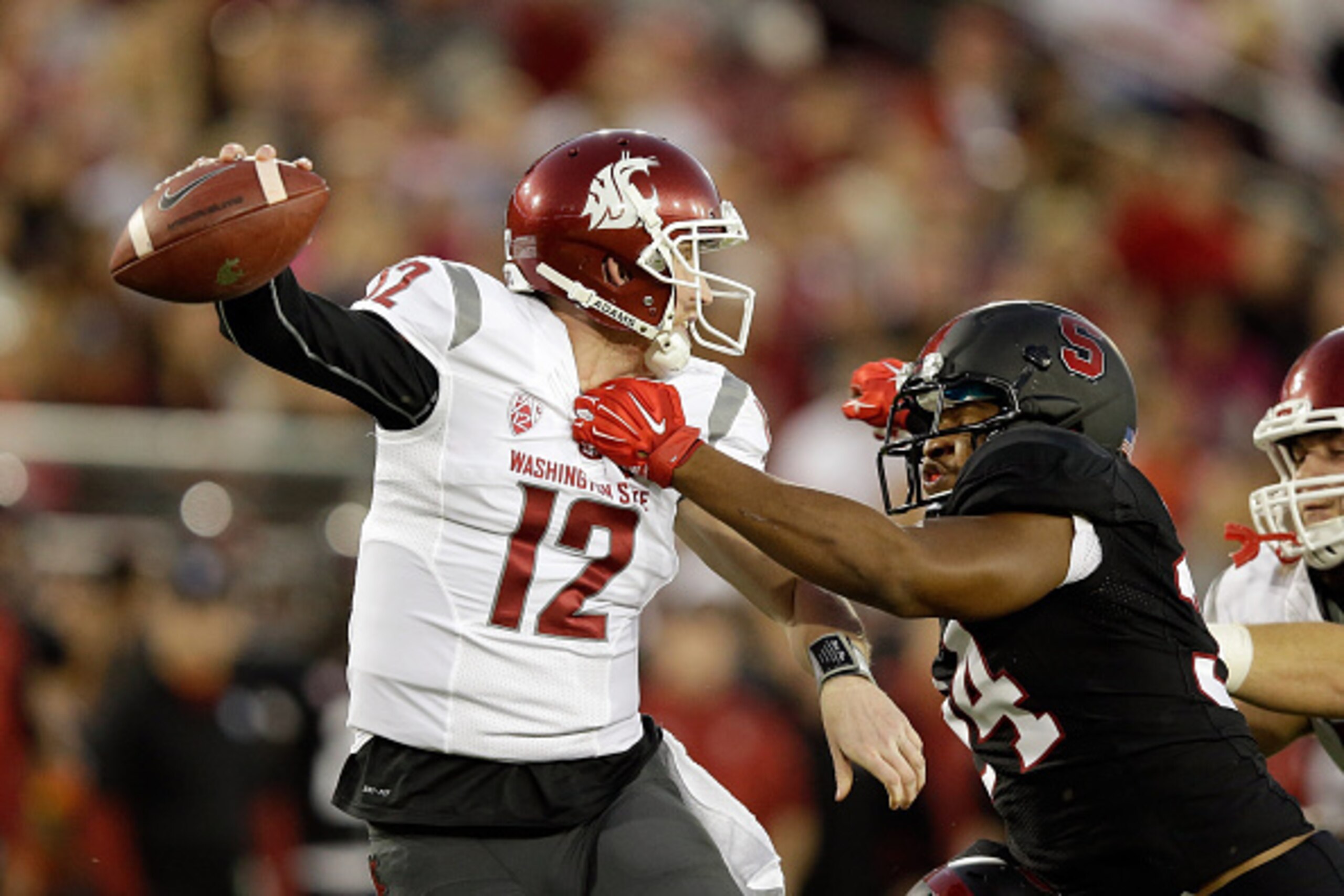 PALO ALTO, CA - OCTOBER 10:  Connor Halliday #12 of the Washington State Cougars is sacked by Peter Kalambayi #34 of the Stanford Cardinal at Stanford Stadium on October 10, 2014 in Palo Alto, California.  (Photo by Ezra Shaw/Getty Images)