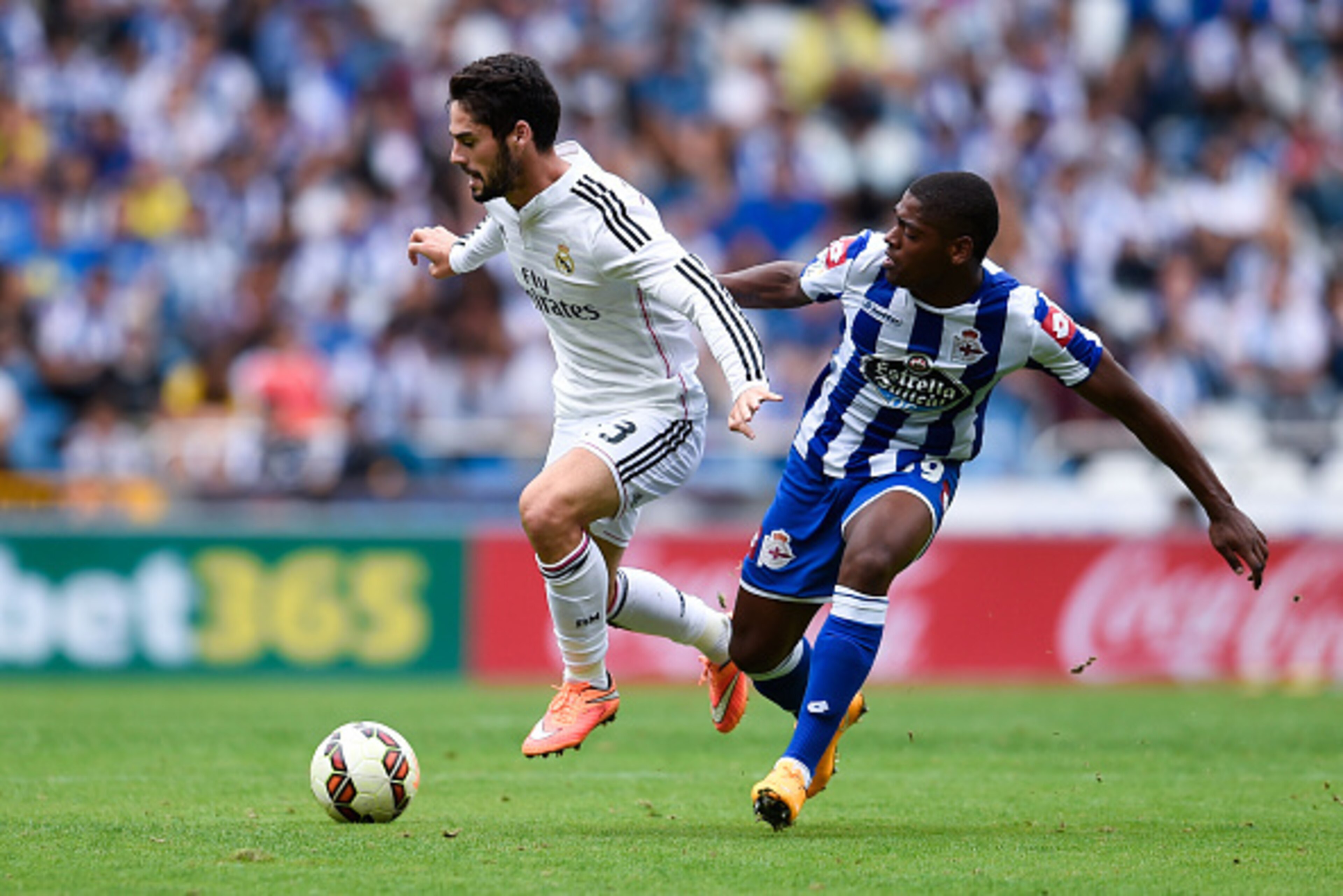 LA CORUNA, SPAIN - SEPTEMBER 20:  Francisco Alarcon Isco of Real Madrid CF competes for the ball with Ivan Cavaleiro of RC Deportivo La Coruna during the La Liga match between RC Deportivo La Coruna and Real Madrid CF at Riazor Stadium on September 20, 20