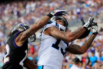 BALTIMORE, MD - SEPTEMBER 28: Cornerback Jimmy Smith #22 of the Baltimore Ravens defendsa as wide receiver Kelvin Benjamin #13 of the Carolina Panthers catches a pass out of bounds during the second half of a game at M&T Bank Stadium on September 28, 2014