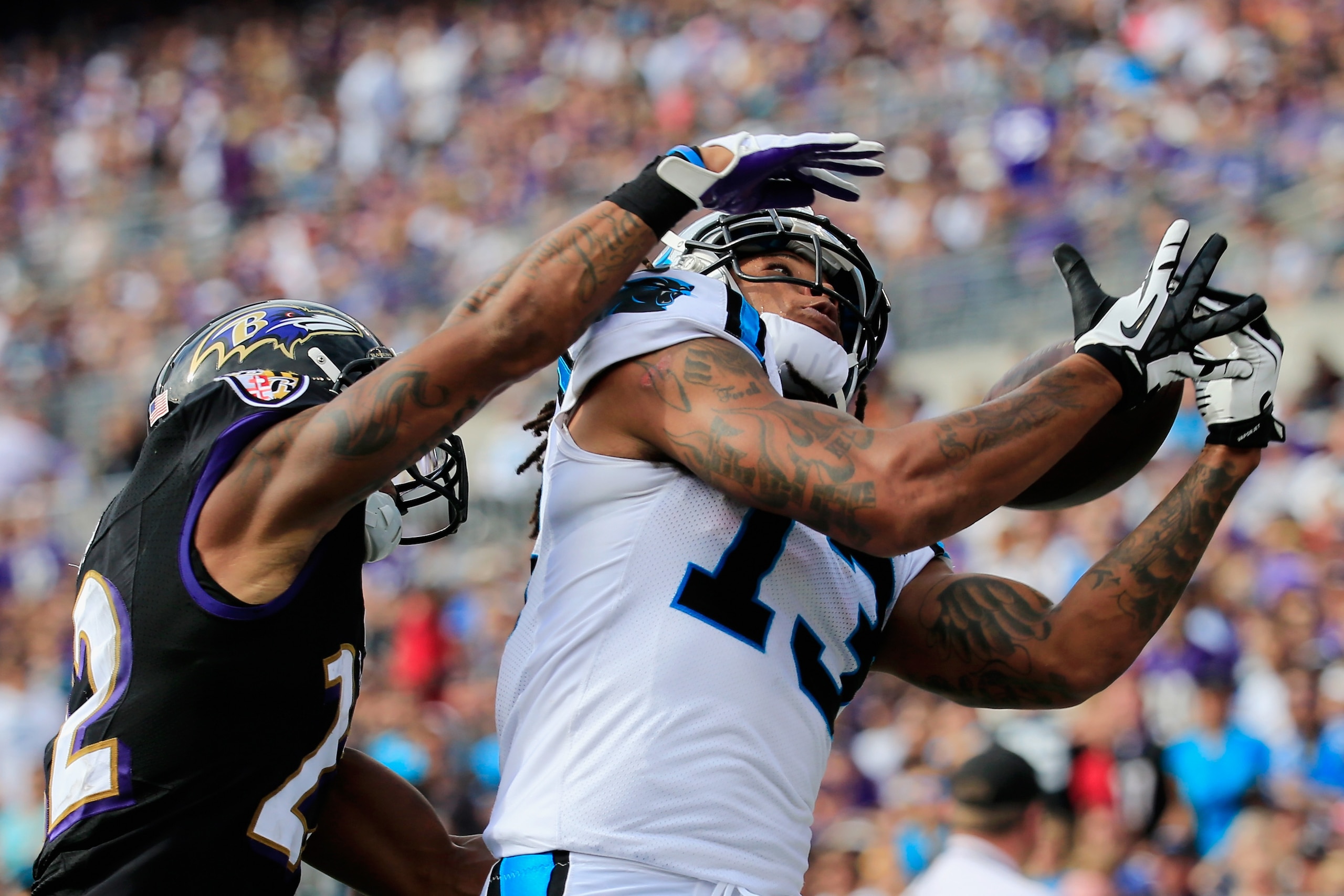 BALTIMORE, MD - SEPTEMBER 28: Cornerback Jimmy Smith #22 of the Baltimore Ravens defendsa as wide receiver Kelvin Benjamin #13 of the Carolina Panthers catches a pass out of bounds during the second half of a game at M&T Bank Stadium on September 28, 2014