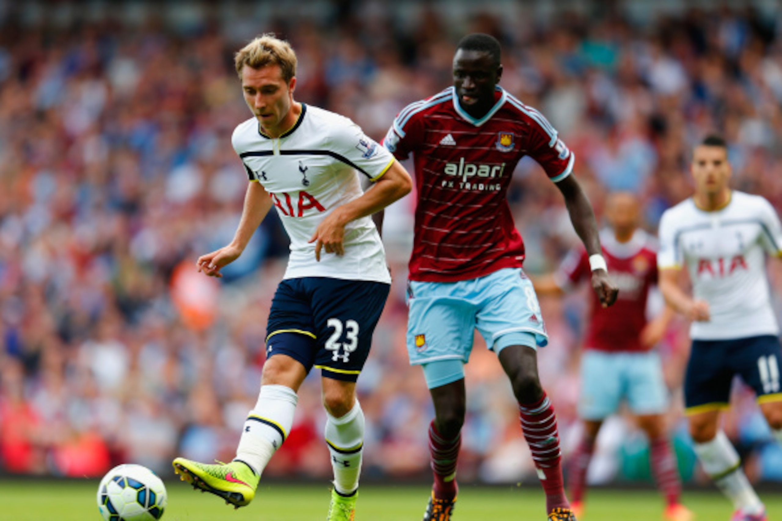 LONDON, ENGLAND - AUGUST 16: Christian Eriksen of Tottenham Hotspur and Cheikhou Kouyate of West Ham United during the Barclays Premier League match between West Ham United and Tottenham Hotspur at Boleyn Ground on August 16, 2014 in London, England.  (Ph