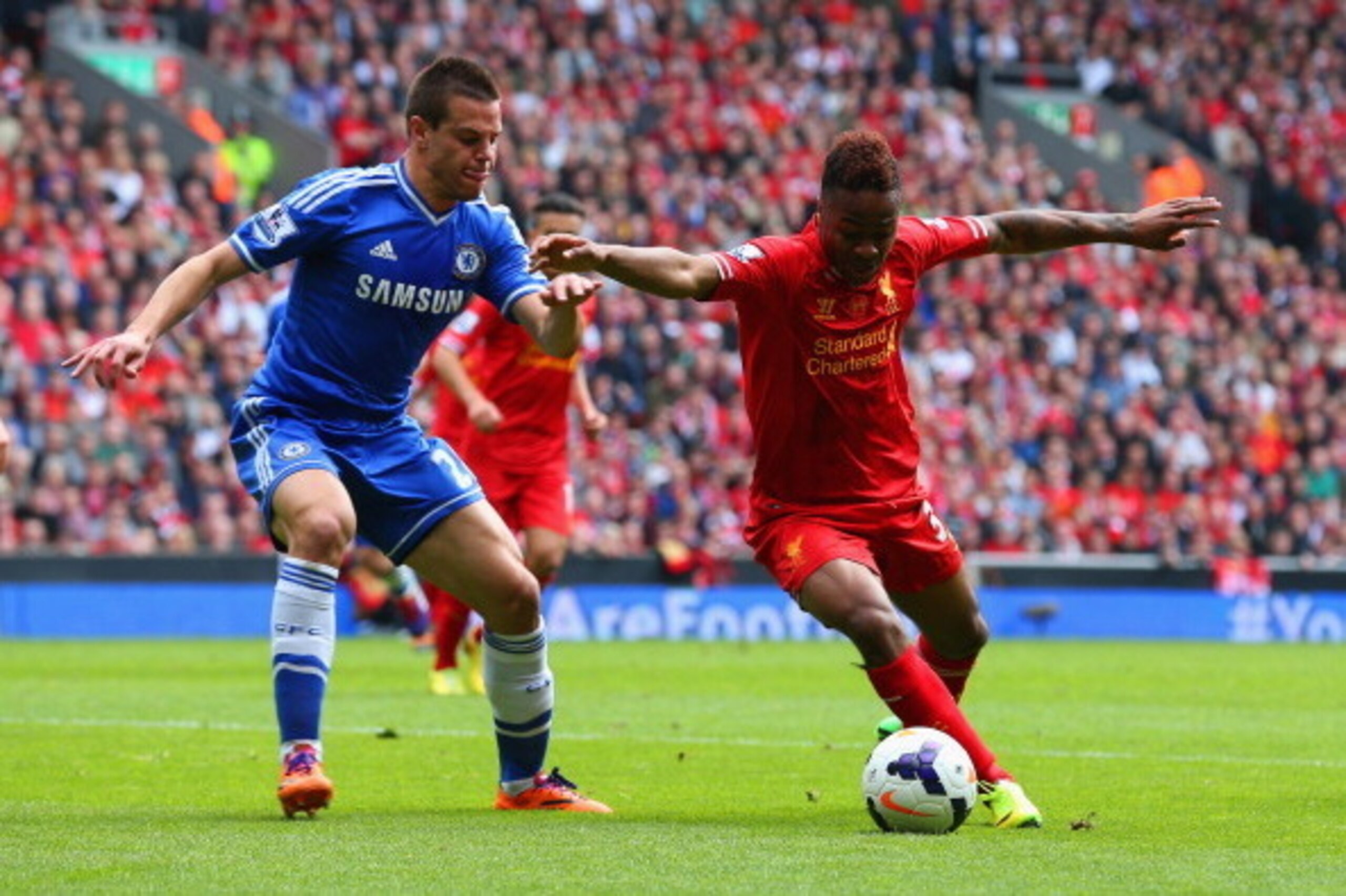 LIVERPOOL, ENGLAND - APRIL 27: Cesar Azpilicueta of Chelsea marshalls Raheem Sterling of Liverpool during the Barclays Premier League match between Liverpool and Chelsea at Anfield on April 27, 2014 in Liverpool, England. (Photo by Clive Brunskill/Getty LIVERPOOL, ENGLAND - APRIL 27: Cesar Azpilicueta of Chelsea marshalls Raheem Sterling of Liverpool during the Barclays Premier League match between Liverpool and Chelsea at Anfield on April 27, 2014 in Liverpool, England. (Photo by Clive Brunskill/Getty