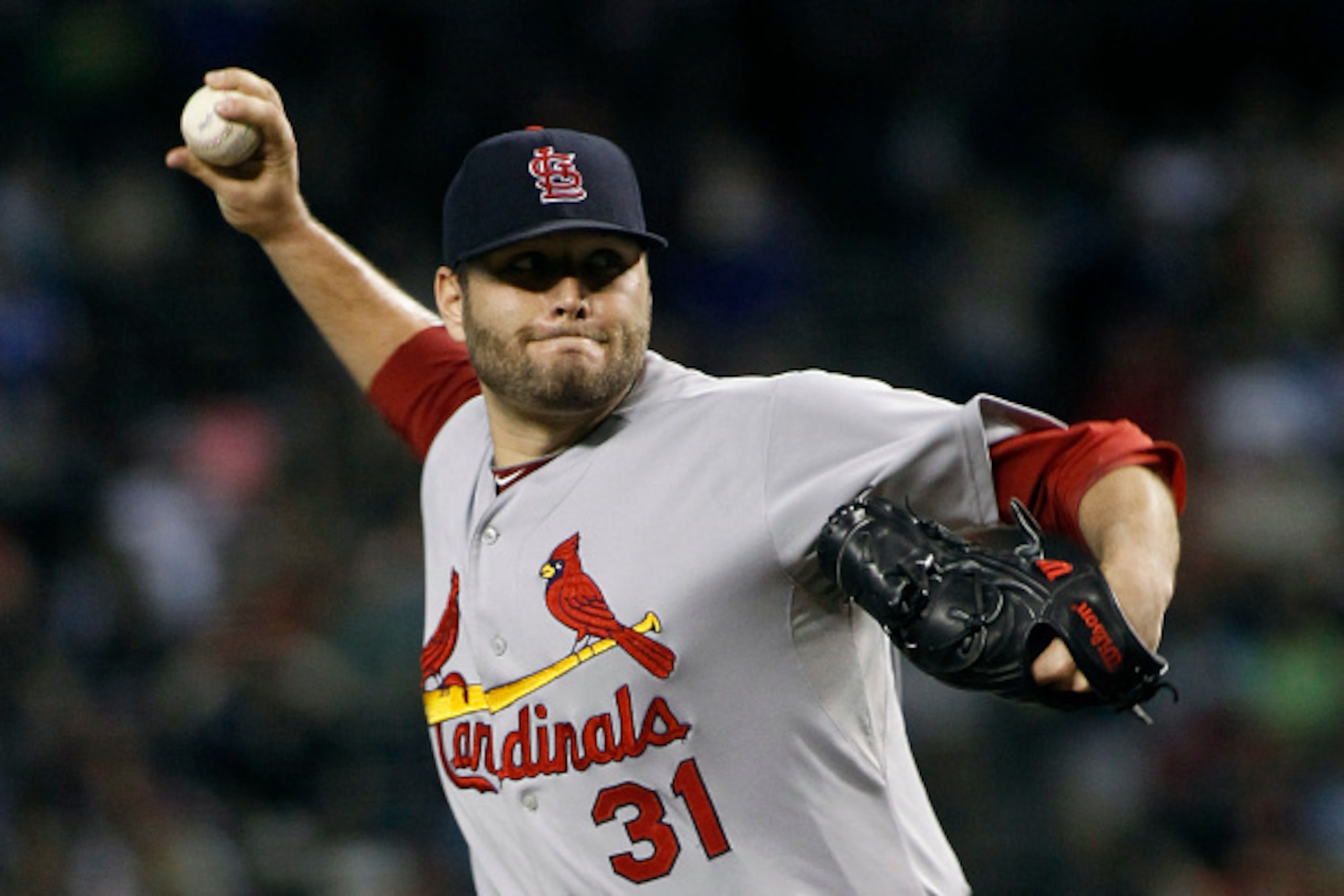 PHOENIX, AZ - SEPTEMBER 27:  Starting pitcher Lance Lynn #31 of the St Louis Cardinals delivers a pitch against the Arizona Diamondbacks during the first inning of a MLB game at Chase Field on September 27, 2014 in Phoenix, Arizona.  (Photo by Ralph Freso