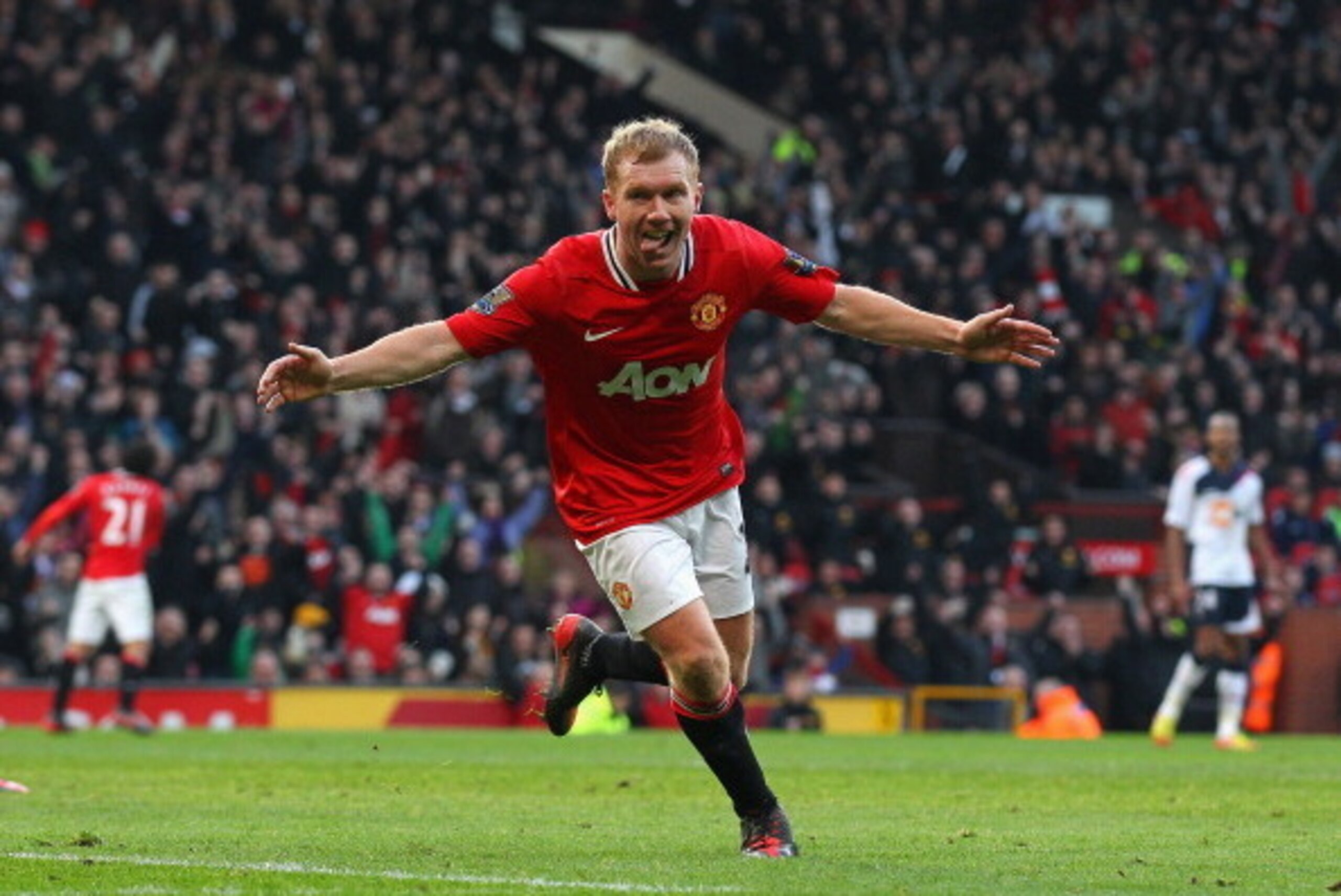 MANCHESTER, ENGLAND - JANUARY 14: Paul Scholes of Manchester United celebrates after scoring the opening goal during the Barclays Premier League match between Manchester United and Bolton Wanderers at Old Trafford on January 14, 2012 in Manchester, Engla MANCHESTER, ENGLAND - JANUARY 14: Paul Scholes of Manchester United celebrates after scoring the opening goal during the Barclays Premier League match between Manchester United and Bolton Wanderers at Old Trafford on January 14, 2012 in Manchester, Engla