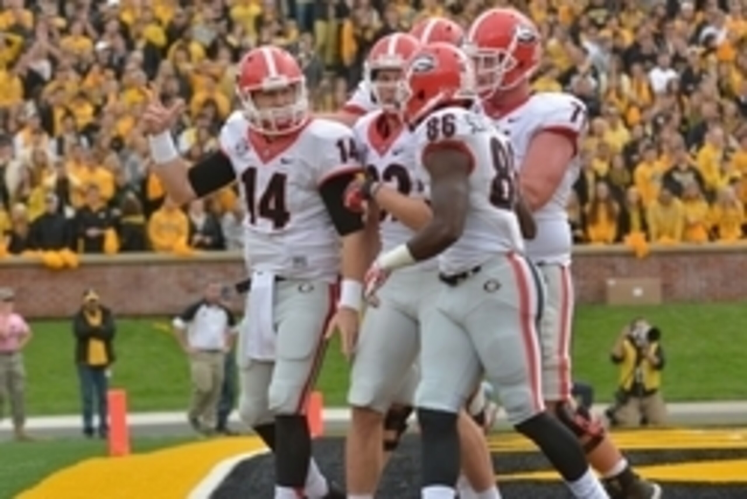 Oct 11, 2014; Columbia, MO, USA; Georgia Bulldogs quarterback Hutson Mason (14) is congratulated by teammates after scoring a touchdown during the first half against the Missouri Tigers at Faurot Field. Mandatory Credit: Denny Medley-USA TODAY Sports