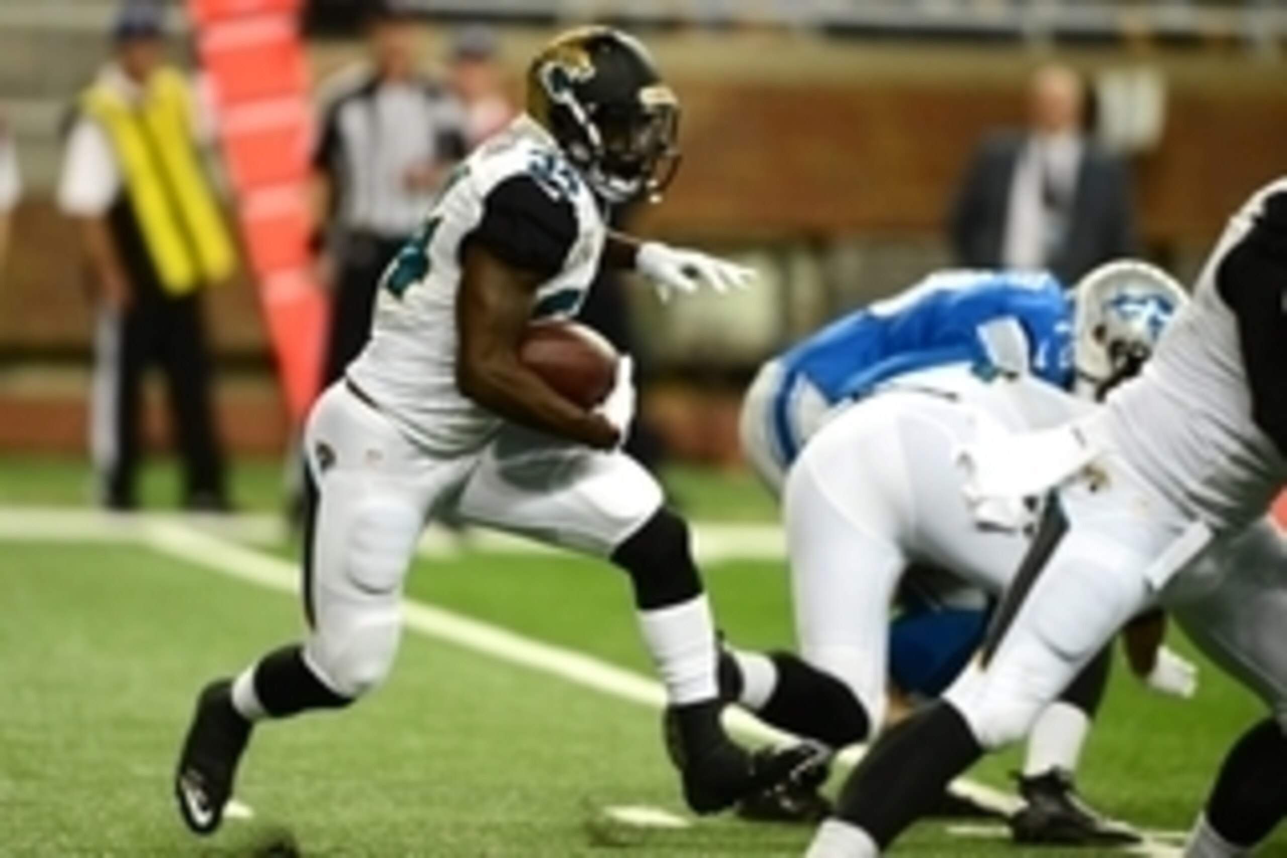 Aug 22, 2014; Detroit, MI, USA; Jacksonville Jaguars running back Storm Johnson (34) runs the ball during the fourth quarter against the Detroit Lions at Ford Field. Mandatory Credit: Andrew Weber-USA TODAY Sports