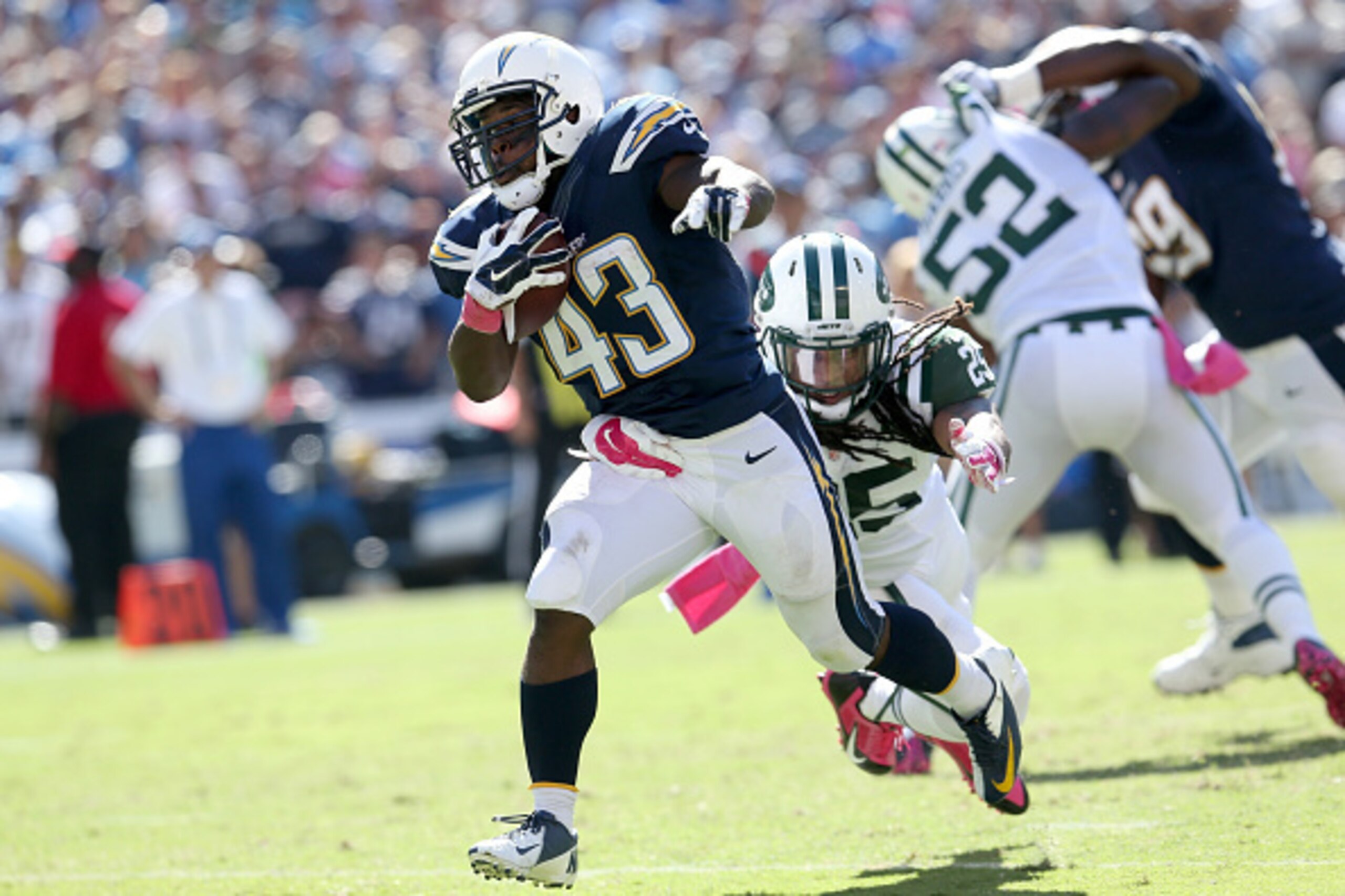 SAN DIEGO, CA - OCTOBER 05:  Running back Branden Oliver #43 of the San Diego Chargers carries the ball past safety Calvin Pryor #25 of the New York Jets on a 15 yard touchdown run in the second quarter at Qualcomm Stadium on October 5, 2014 in San Diego,