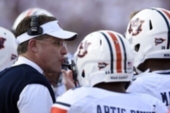 Oct 11, 2014; Starkville, MS, USA; Auburn Tigers head coach Gus Malzahn talks with his players during a timeout against the Mississippi State Bulldogs during the first quarter at Davis Wade Stadium. Mandatory Credit: John David Mercer-USA TODAY Sports