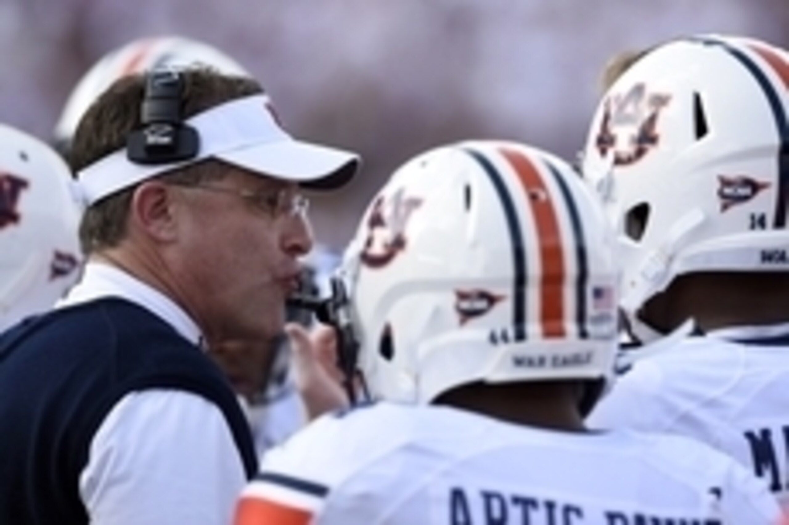 Oct 11, 2014; Starkville, MS, USA; Auburn Tigers head coach Gus Malzahn talks with his players during a timeout against the Mississippi State Bulldogs during the first quarter at Davis Wade Stadium. Mandatory Credit: John David Mercer-USA TODAY Sports