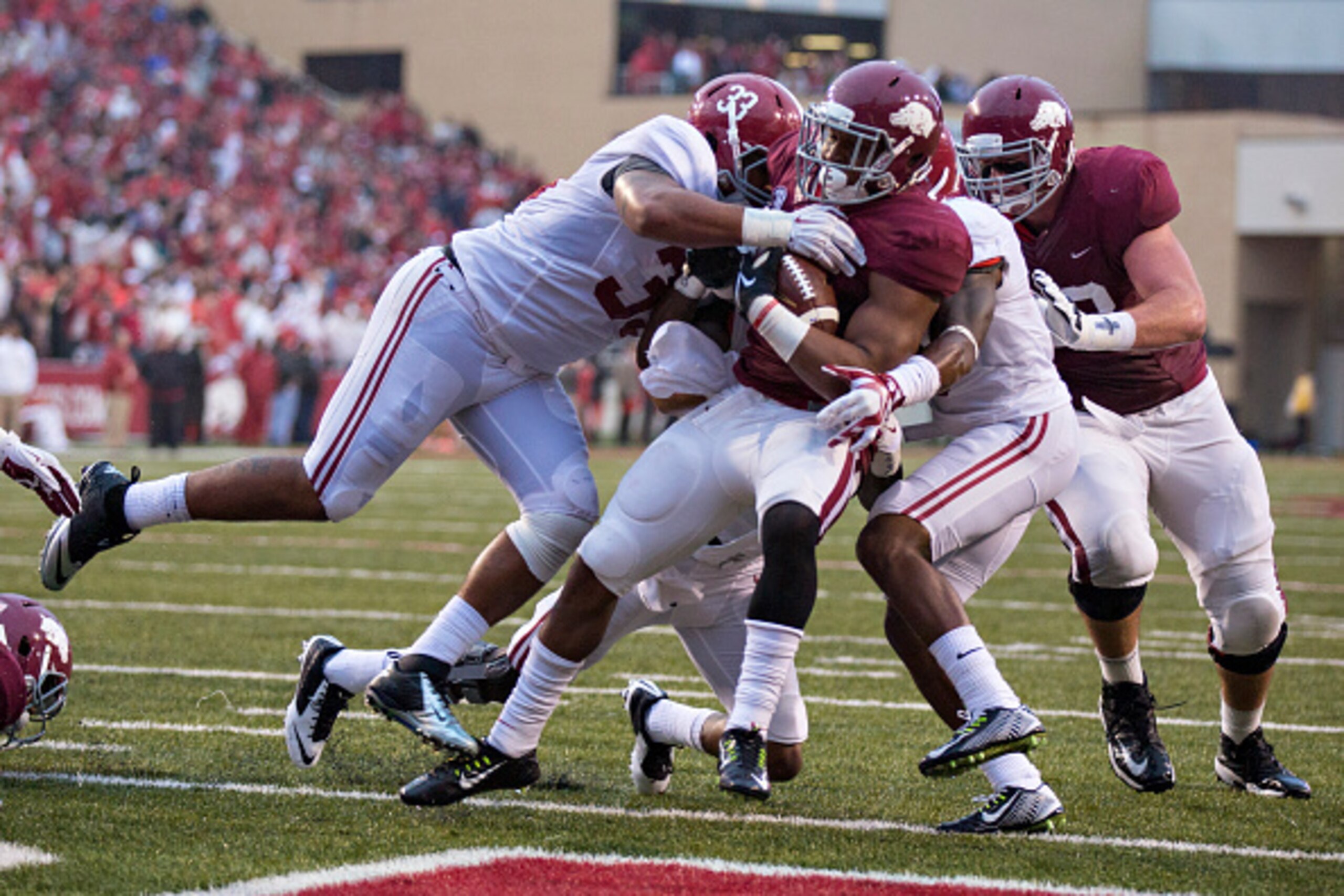 FAYETTEVILLE, AR - OCTOBER 11:  Jonathan Williams #32 of the Arkansas Razorbacks runs the ball for a touchdown against the Alabama Crimson Tide at Razorback Stadium on October 11, 2014 in Fayetteville, Arkansas.  (Photo by Wesley Hitt/Getty Images)