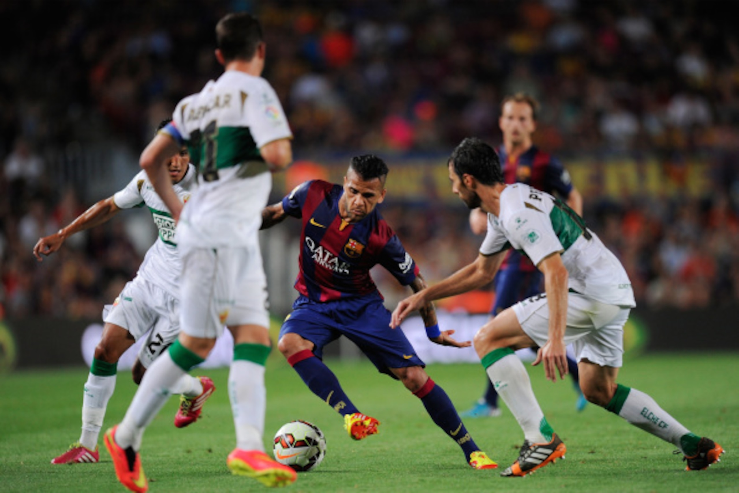 BARCELONA, SPAIN - AUGUST 24:  Dani Alves of FC Barcelona in action during the La Liga match between FC Barcelona and Elche FC at Camp Nou stadium on August 24, 2014 in Barcelona, Spain.  (Photo by Denis Doyle/Getty Images)